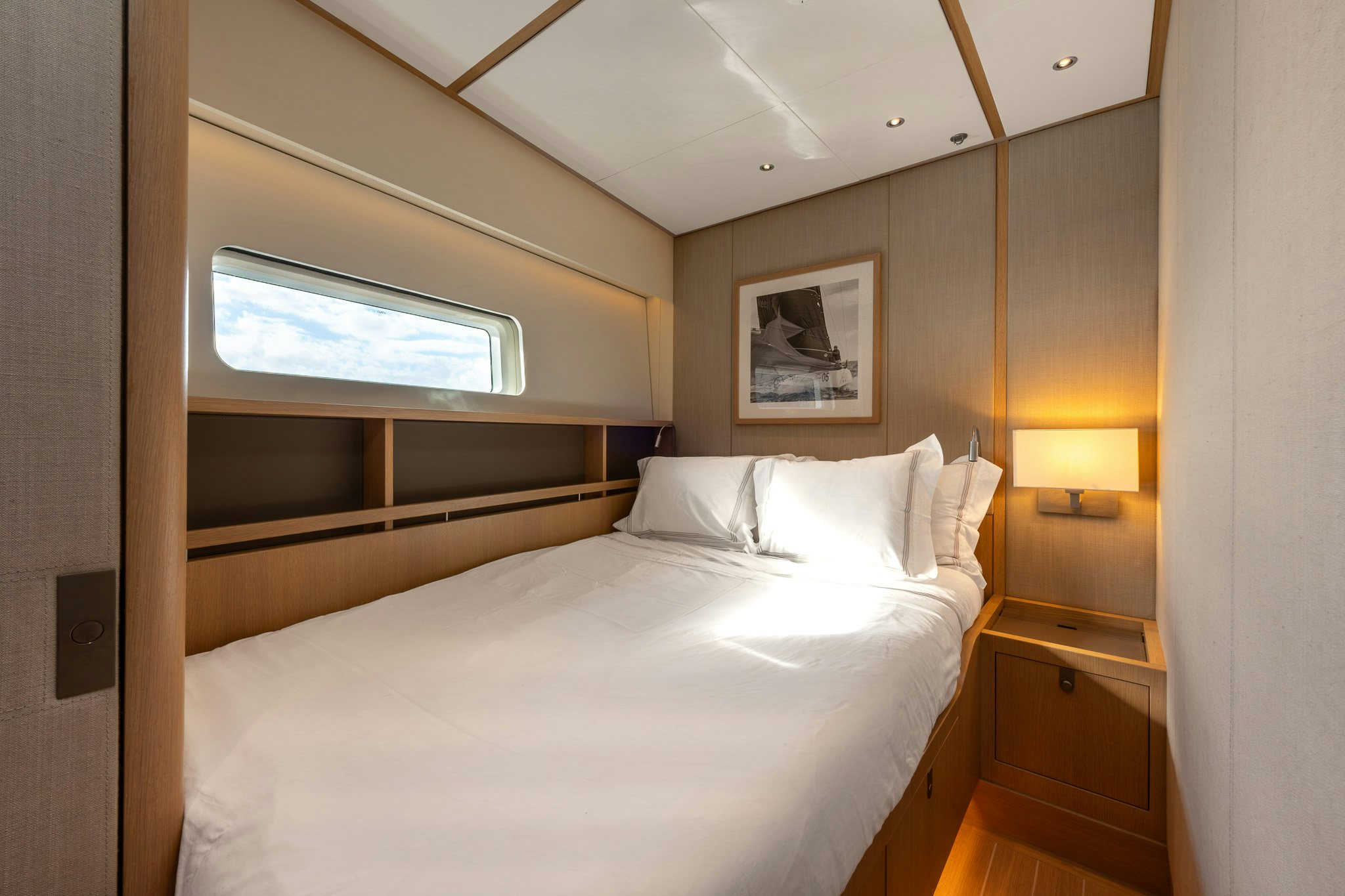 a room with a bed and a window aboard ALIX Yacht for Sale