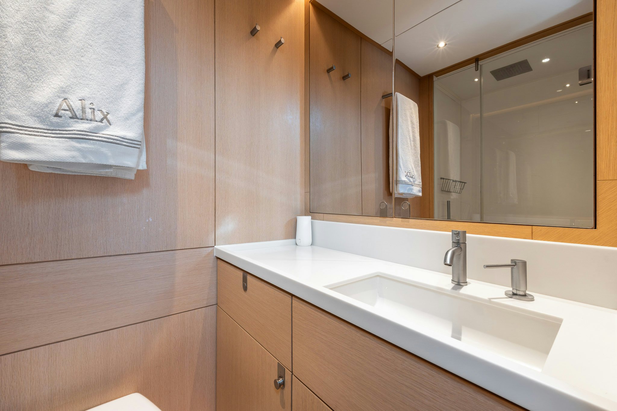 a bathroom with a large mirror aboard ALIX Yacht for Sale