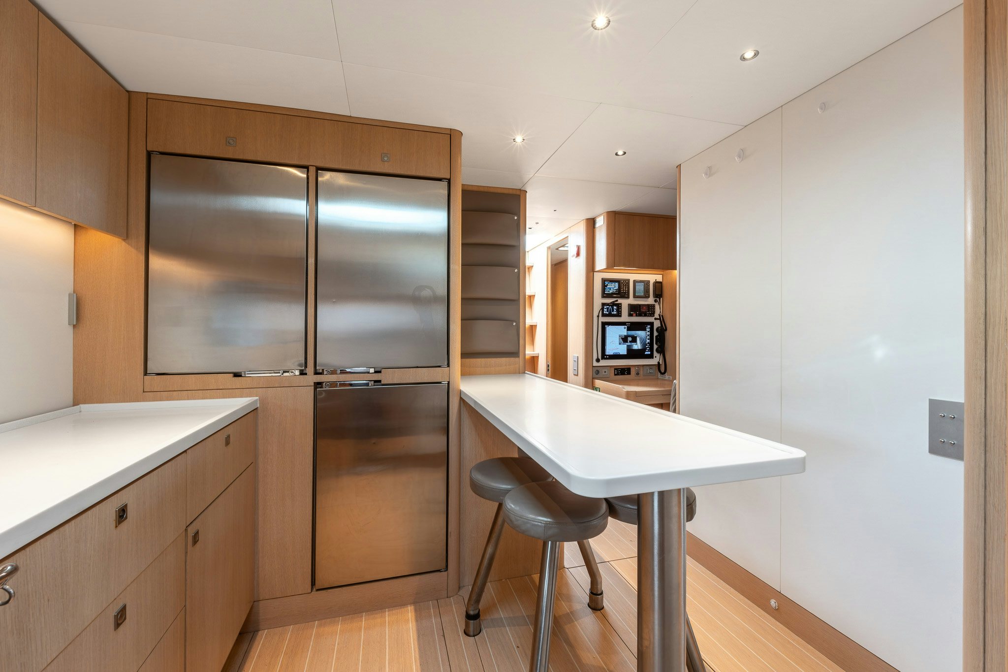 a kitchen with a table and chairs aboard ALIX Yacht for Sale