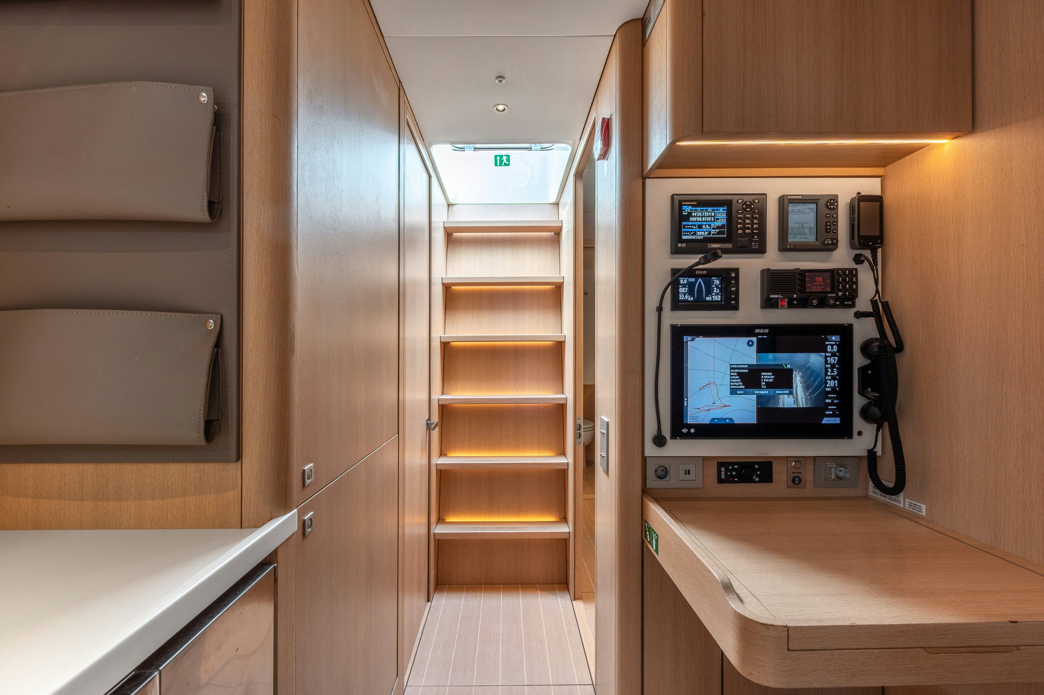 a room with a computer and a shelf with a tv aboard ALIX Yacht for Sale