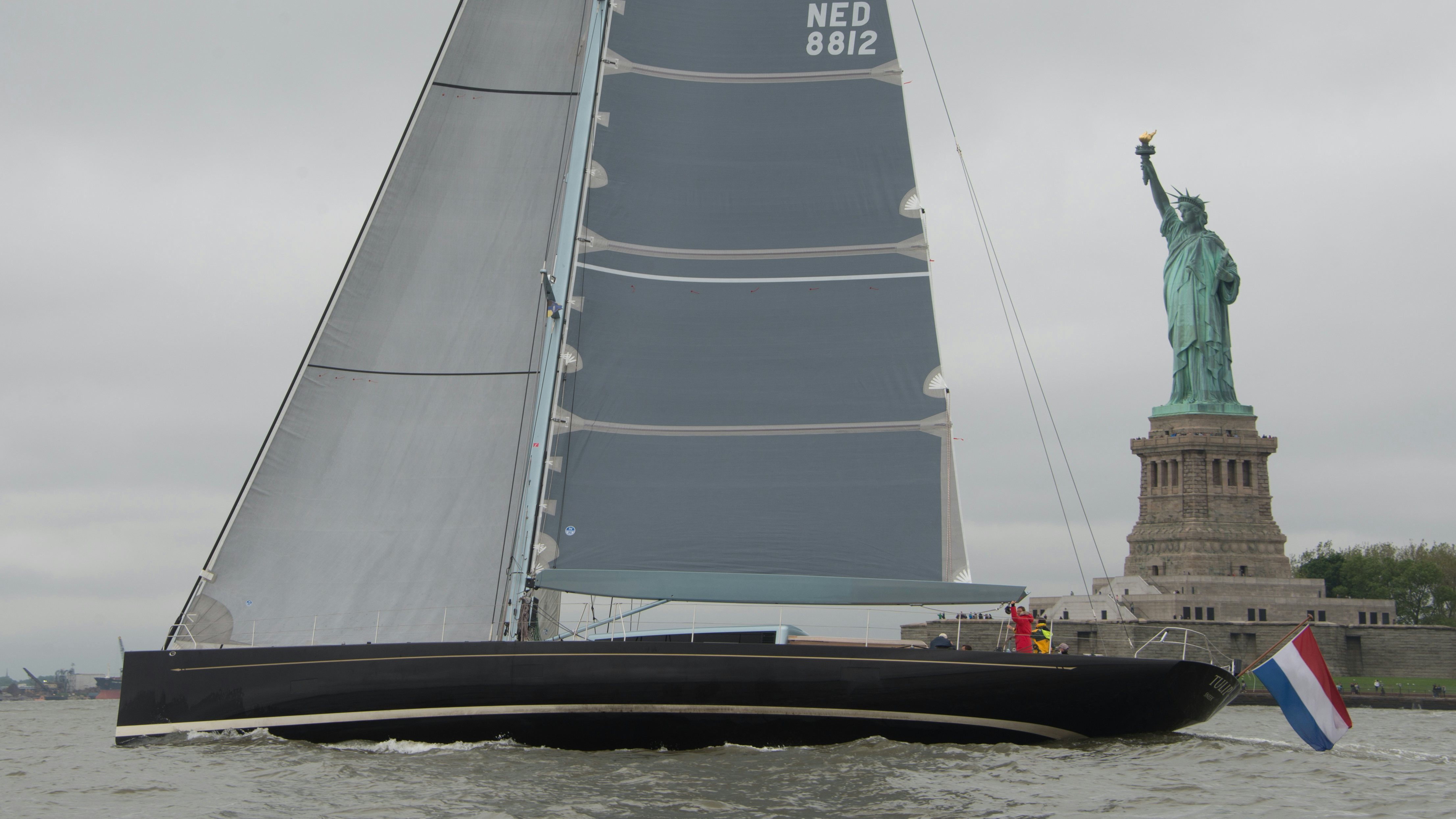 a boat with a statue of a person on it aboard TULIP Yacht for Sale