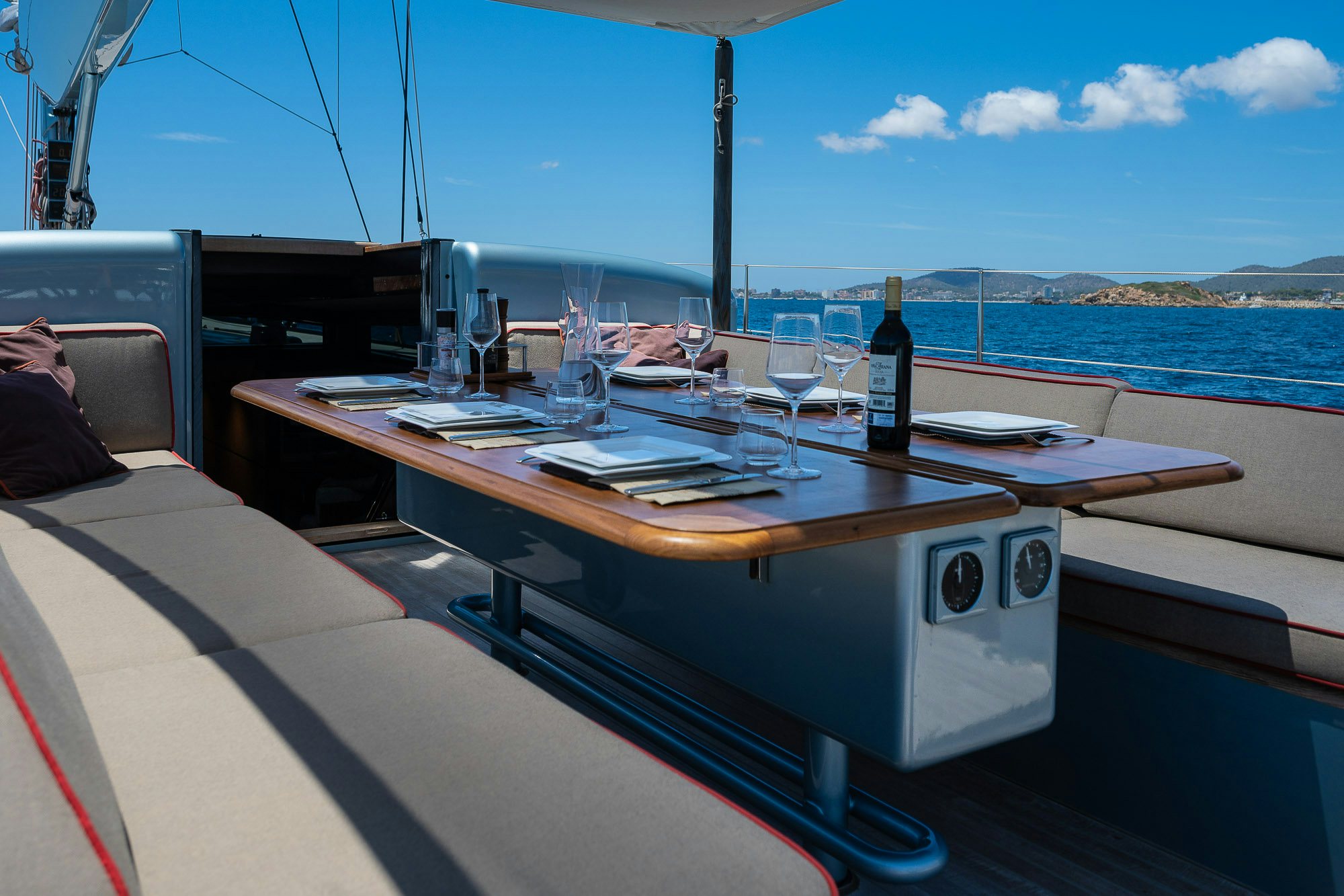 a table with wine bottles on it aboard TULIP Yacht for Sale