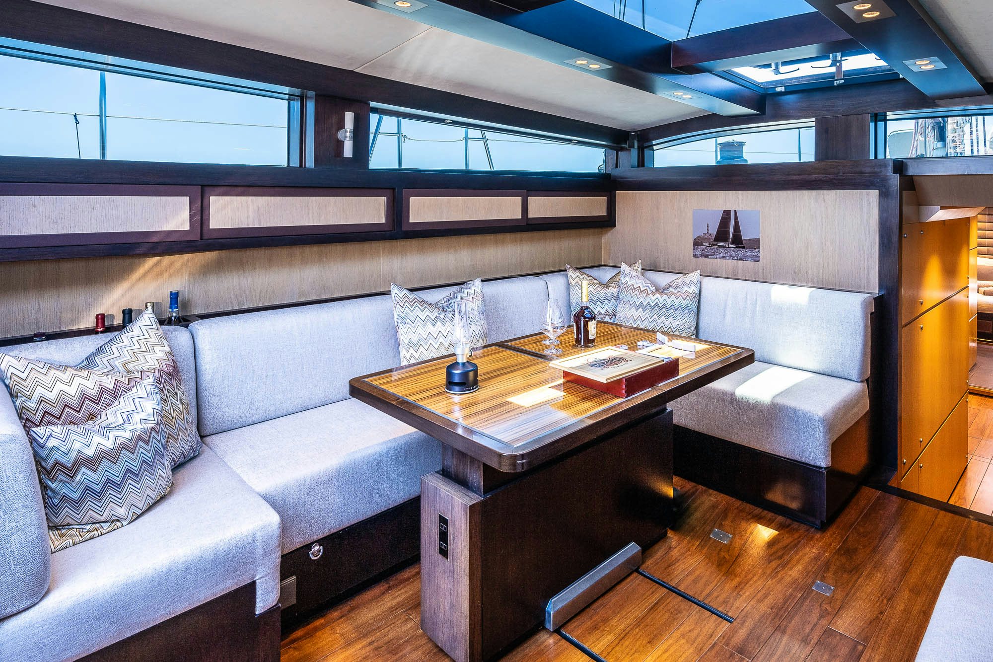 a room with a couch and a coffee table aboard TULIP Yacht for Sale