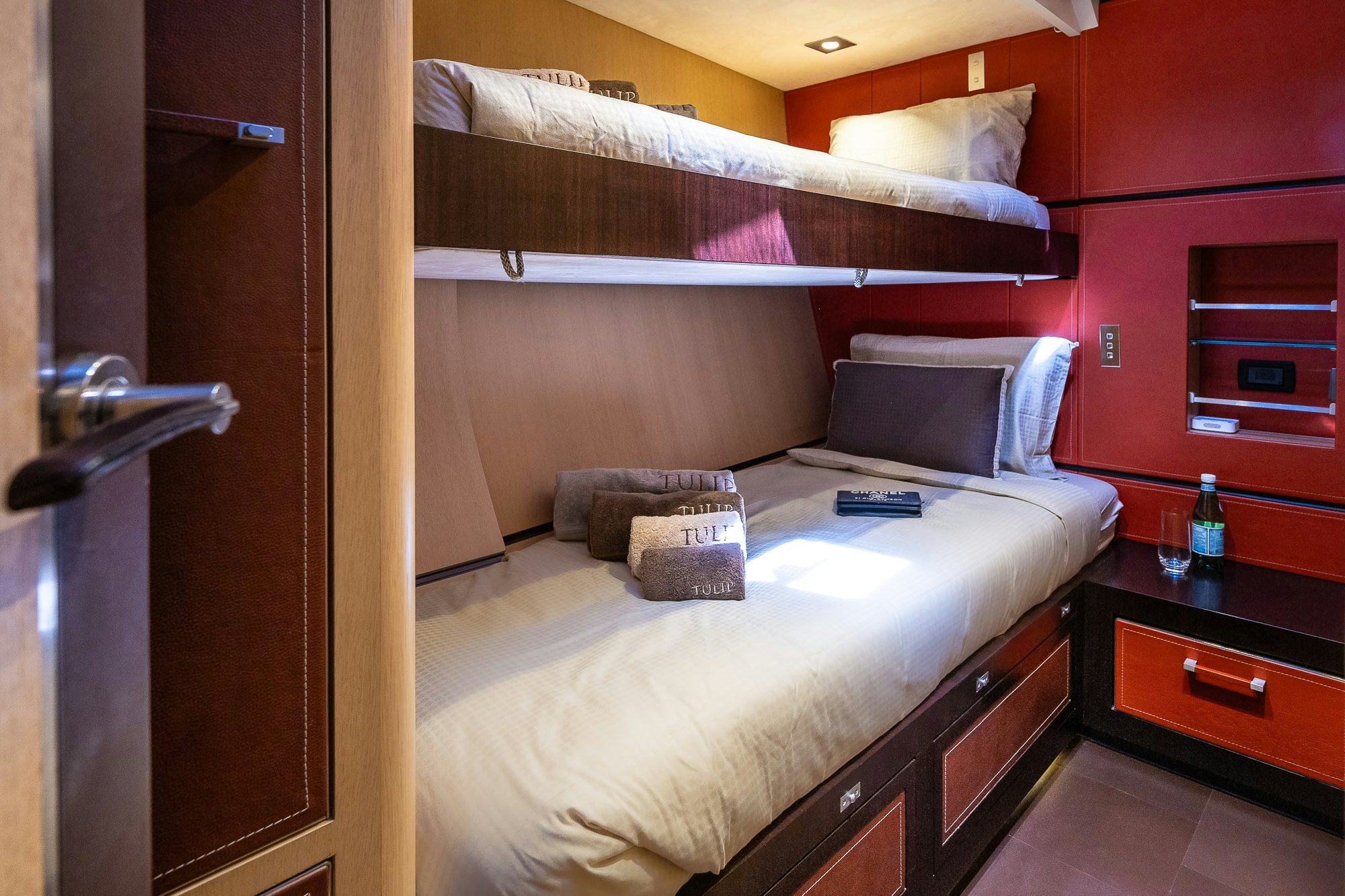 a bed with a white bed aboard TULIP Yacht for Sale