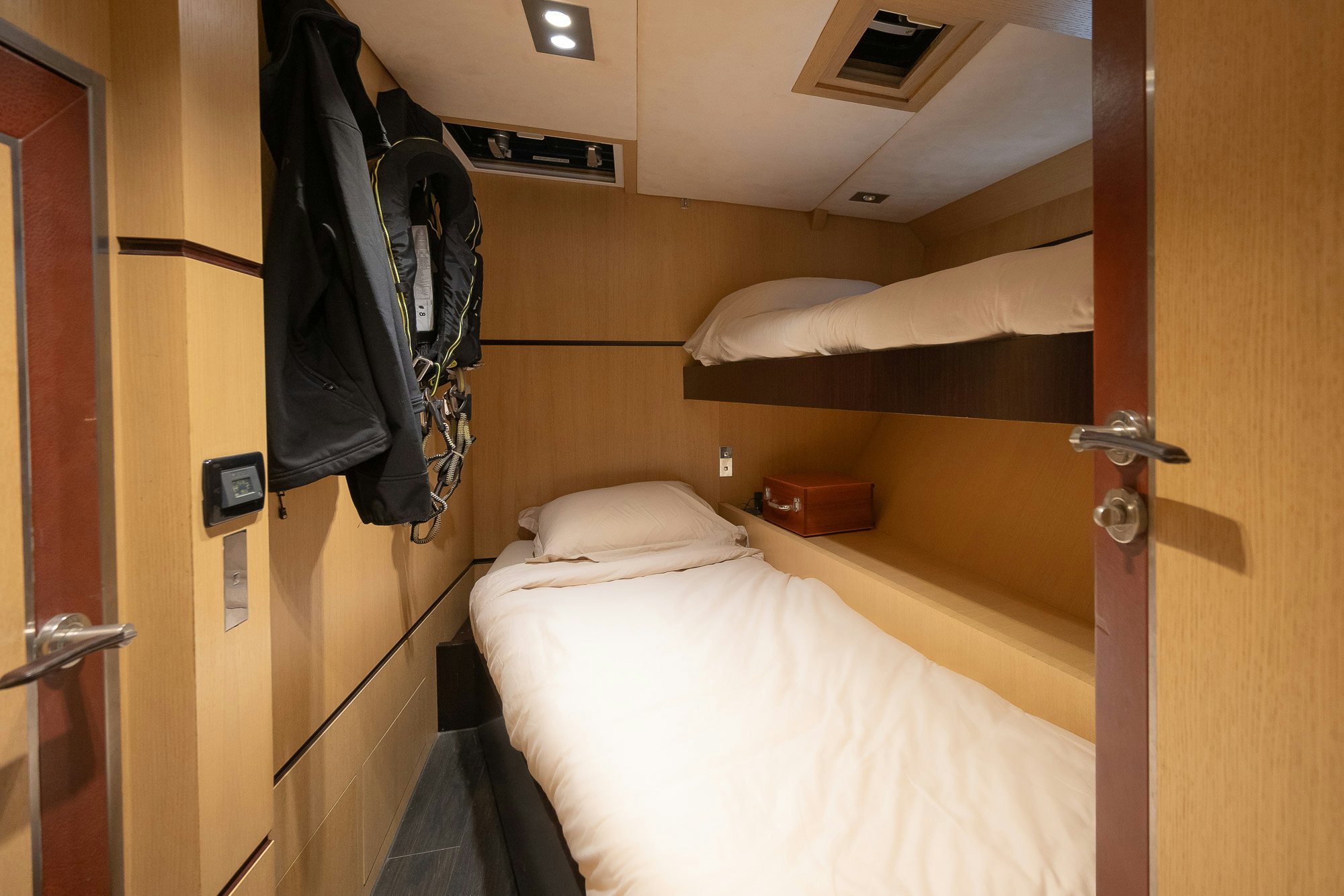 a room with a bed and a closet aboard TULIP Yacht for Sale