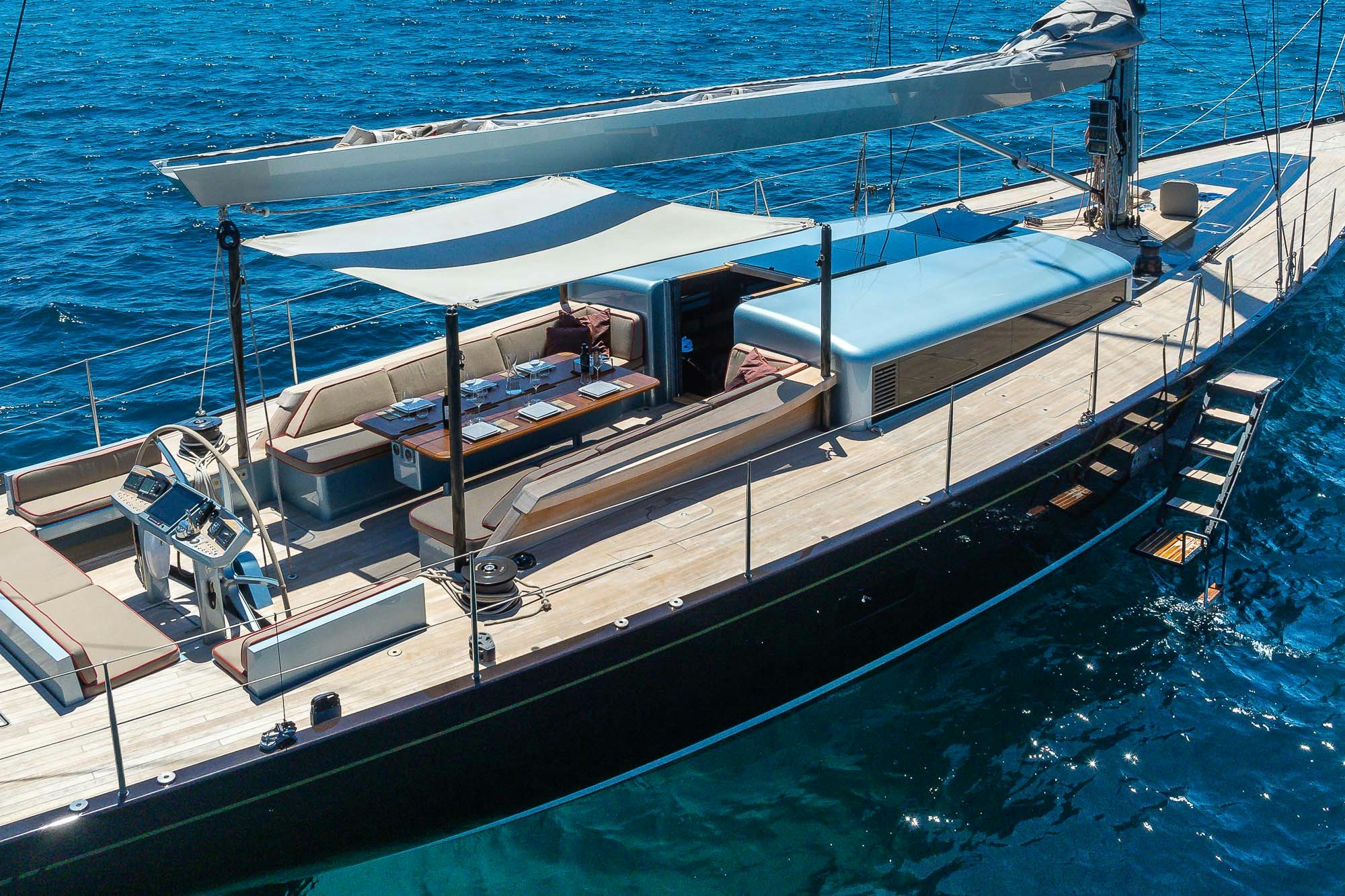 a large ship in the water aboard TULIP Yacht for Sale