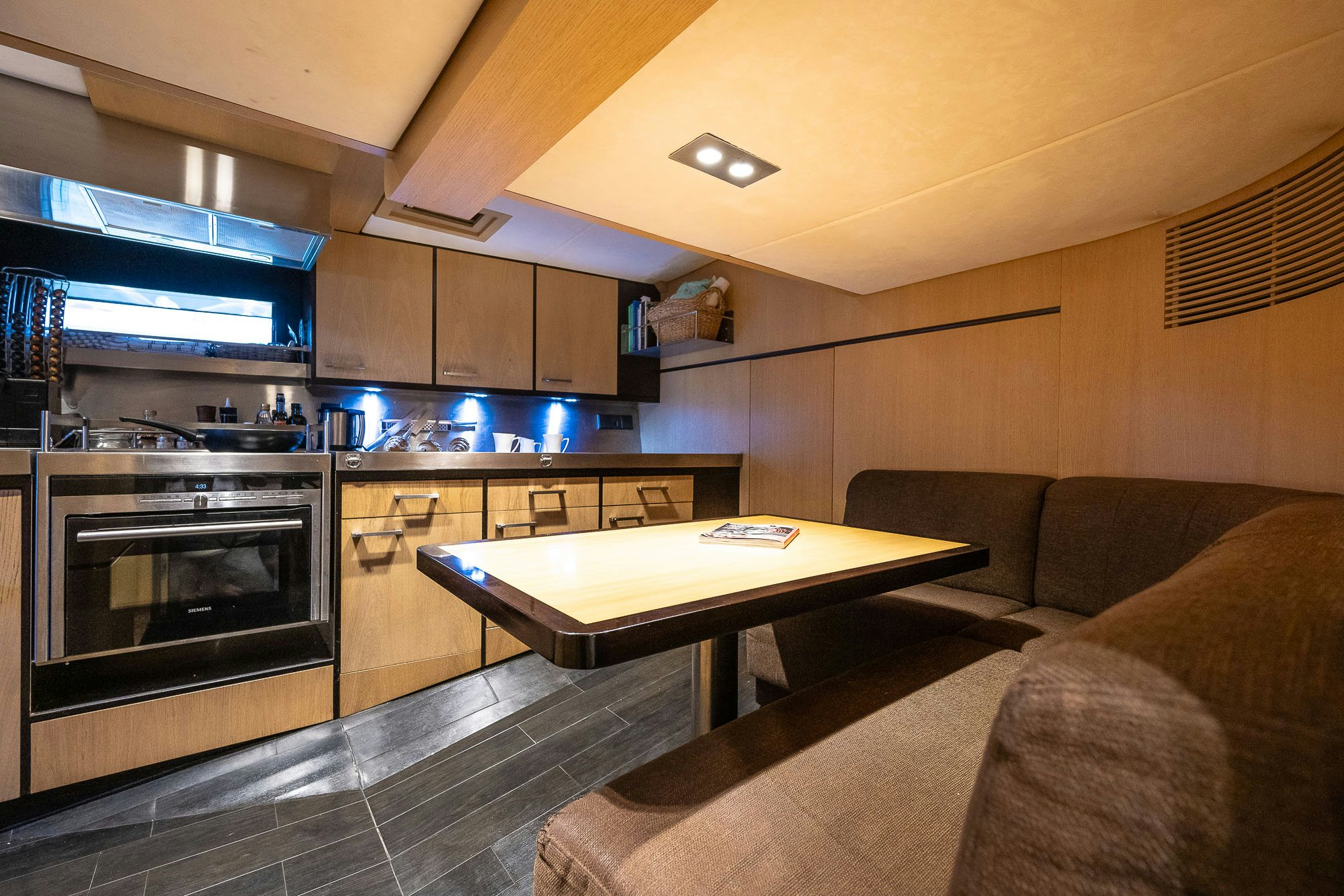a living room with a fireplace aboard TULIP Yacht for Sale