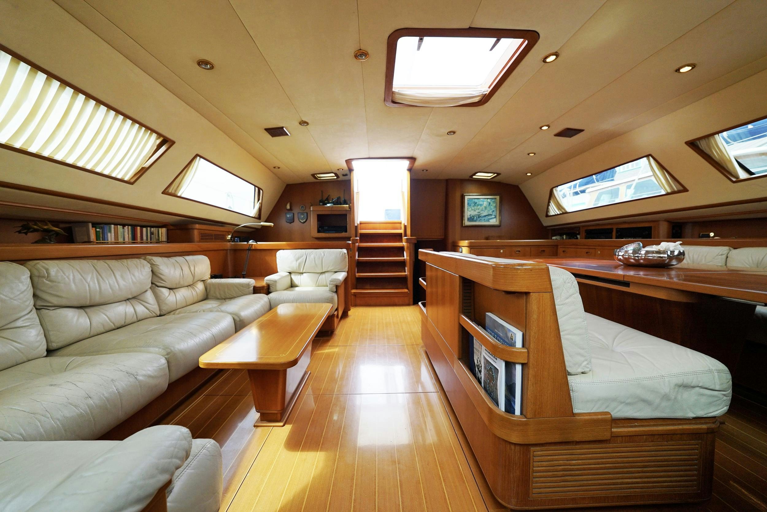a room with a couch and a bed aboard GIBIAN Yacht for Sale