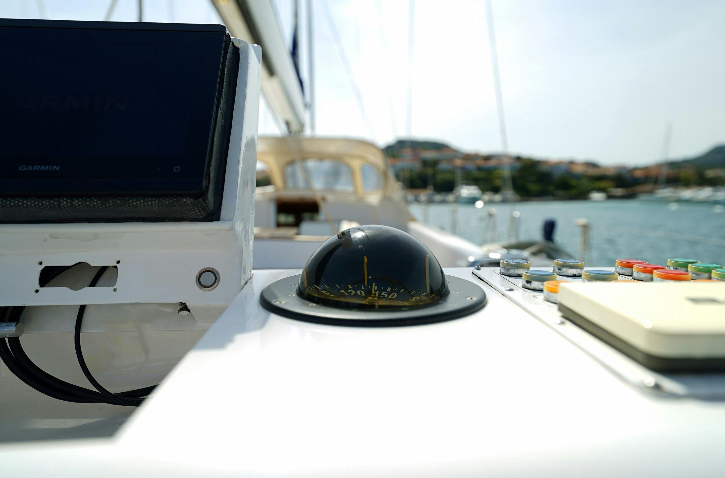a laptop and a desktop computer on a table aboard GIBIAN Yacht for Sale