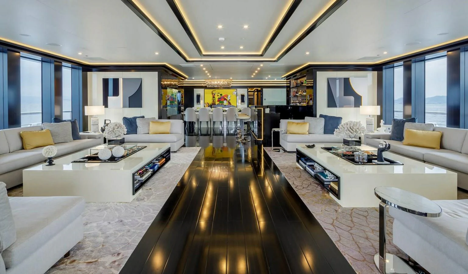 a large living room with a wood floor aboard SAPPHIRE Yacht for Charter