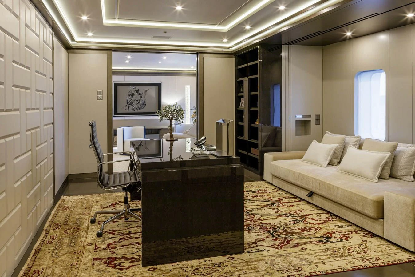 a room with a bed and a desk aboard SAPPHIRE Yacht for Charter