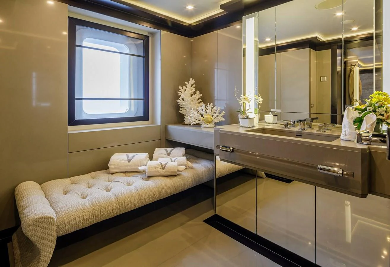 a bathroom with a bed and a sink aboard SAPPHIRE Yacht for Charter