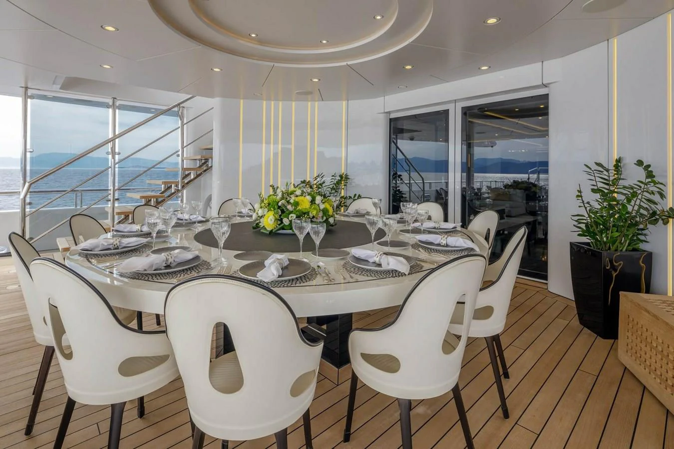 a dining room with white chairs aboard SAPPHIRE Yacht for Charter