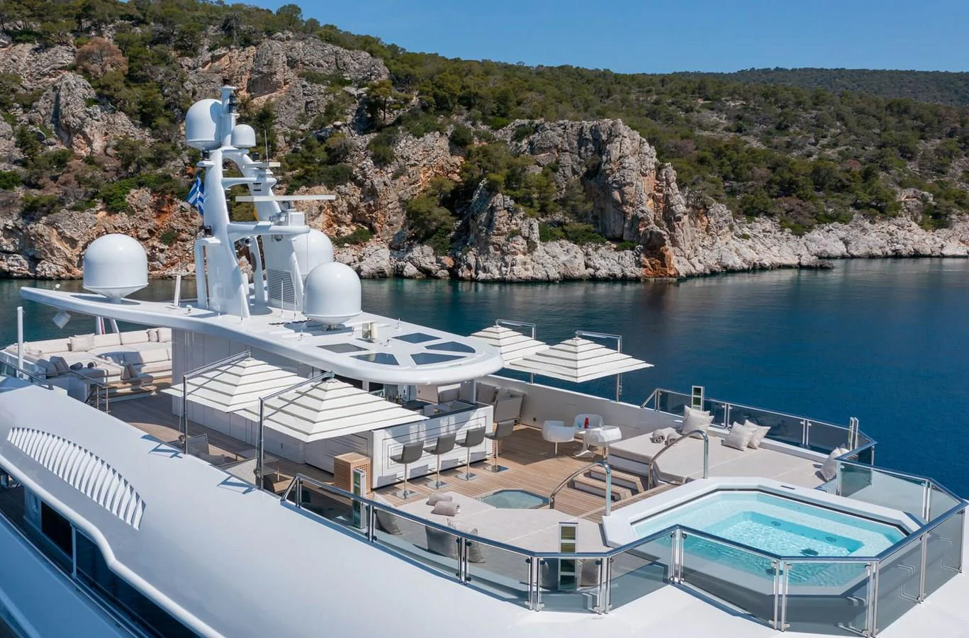 a large white building with a large white tower on a rocky hill aboard SAPPHIRE Yacht for Charter