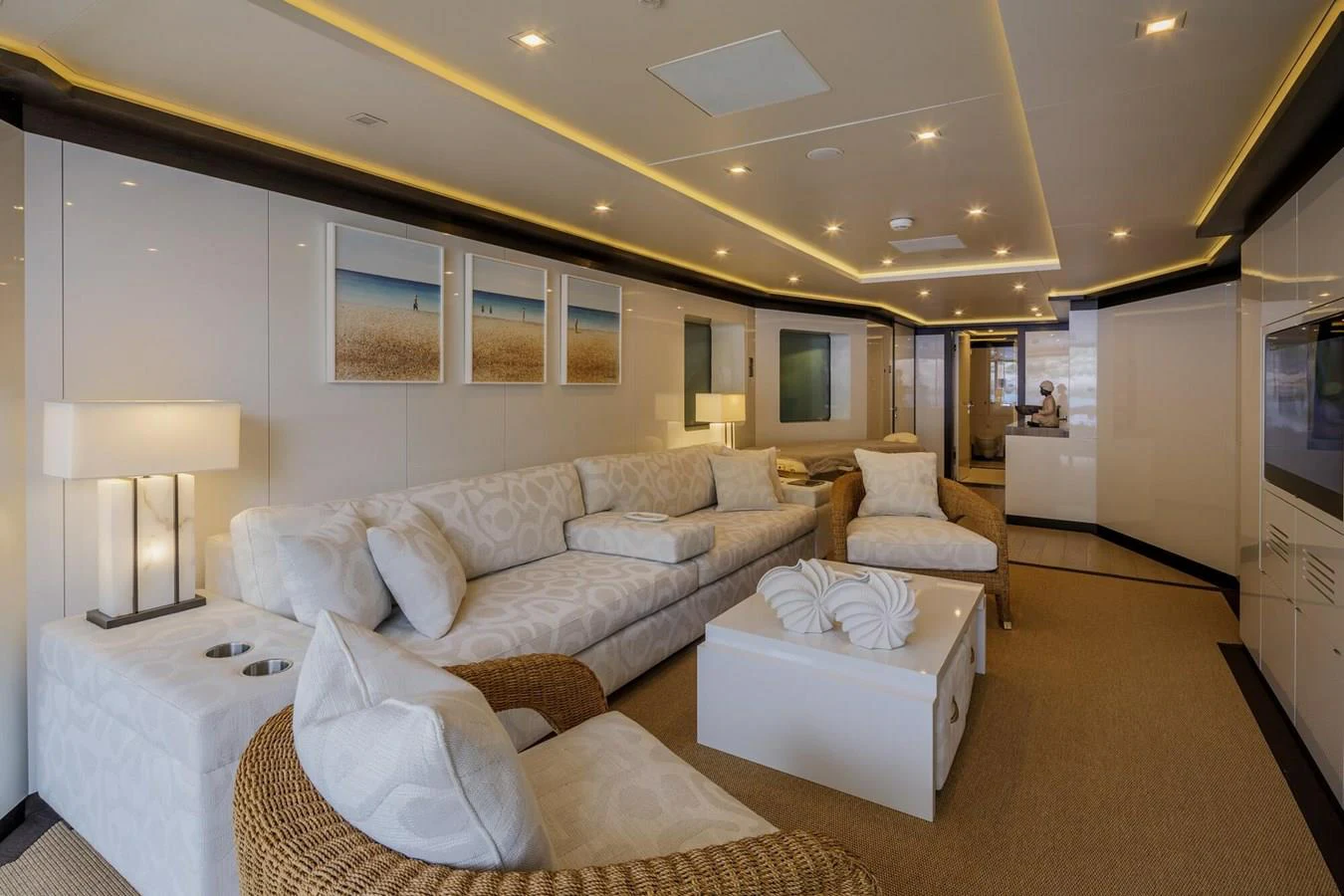 a living room with a couch and a television aboard SAPPHIRE Yacht for Charter
