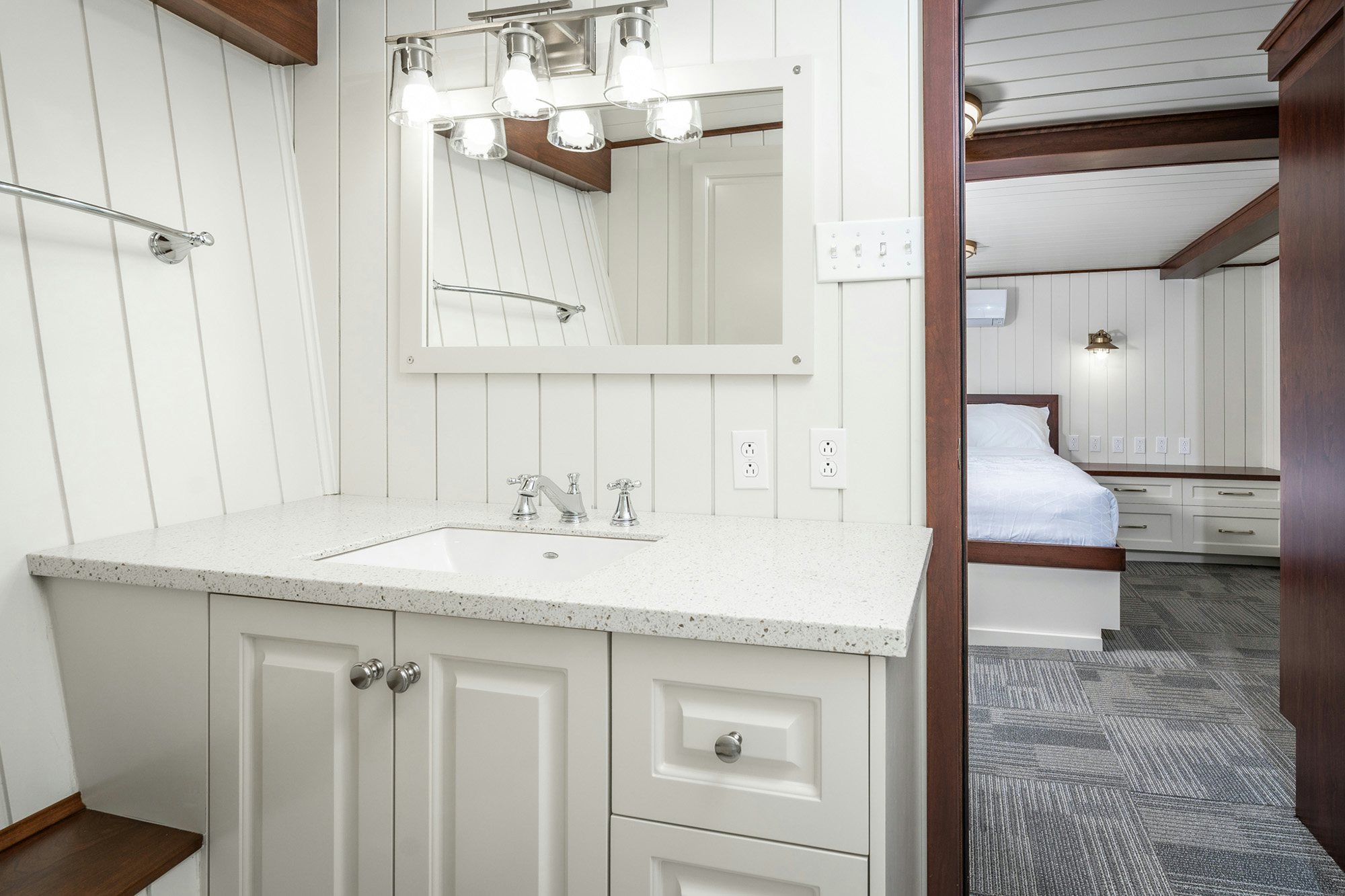 a bathroom with a sink and a bed aboard ANNE S PIERCE Yacht for Sale