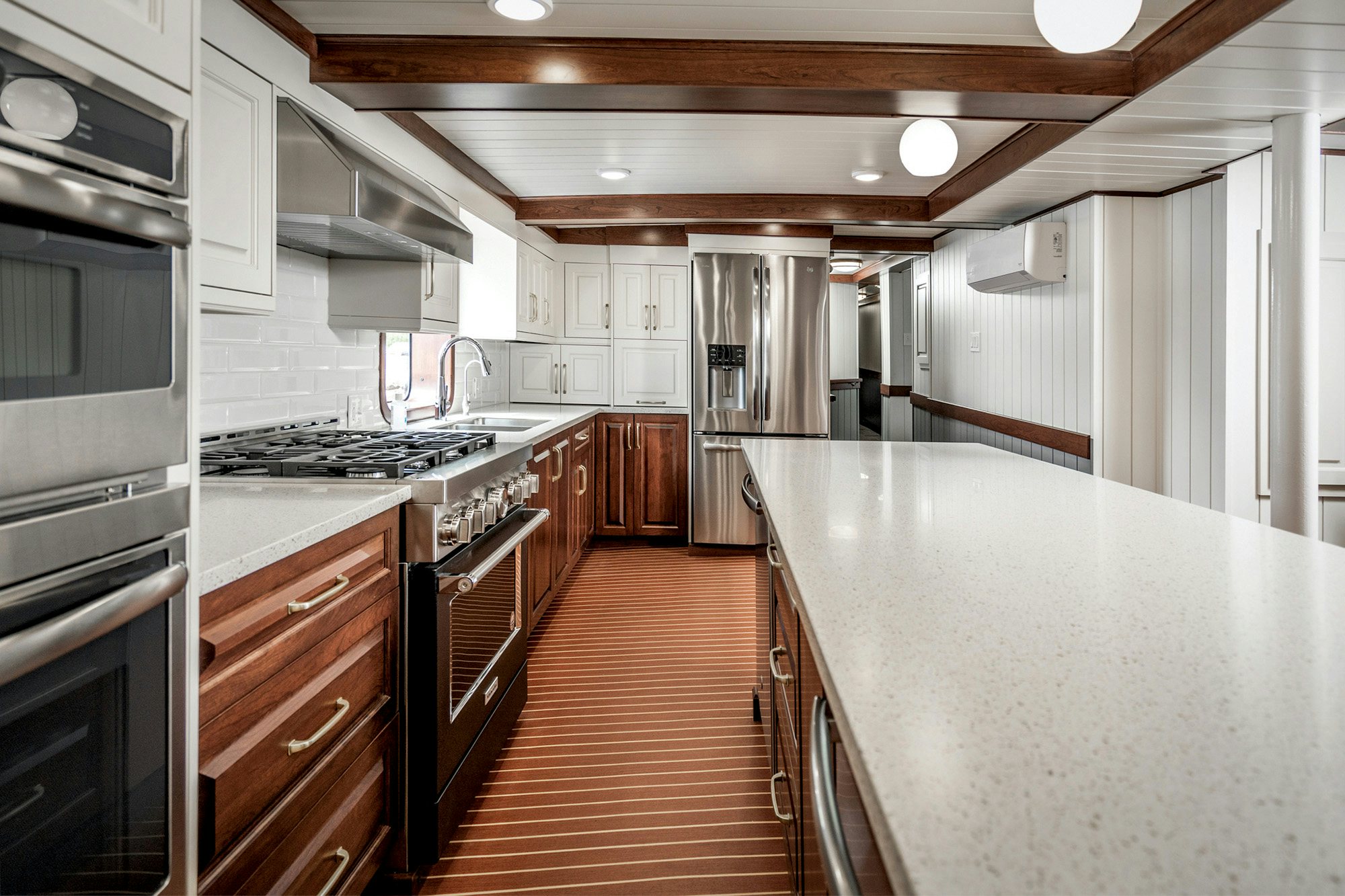 a kitchen with a wood floor aboard ANNE S PIERCE Yacht for Sale