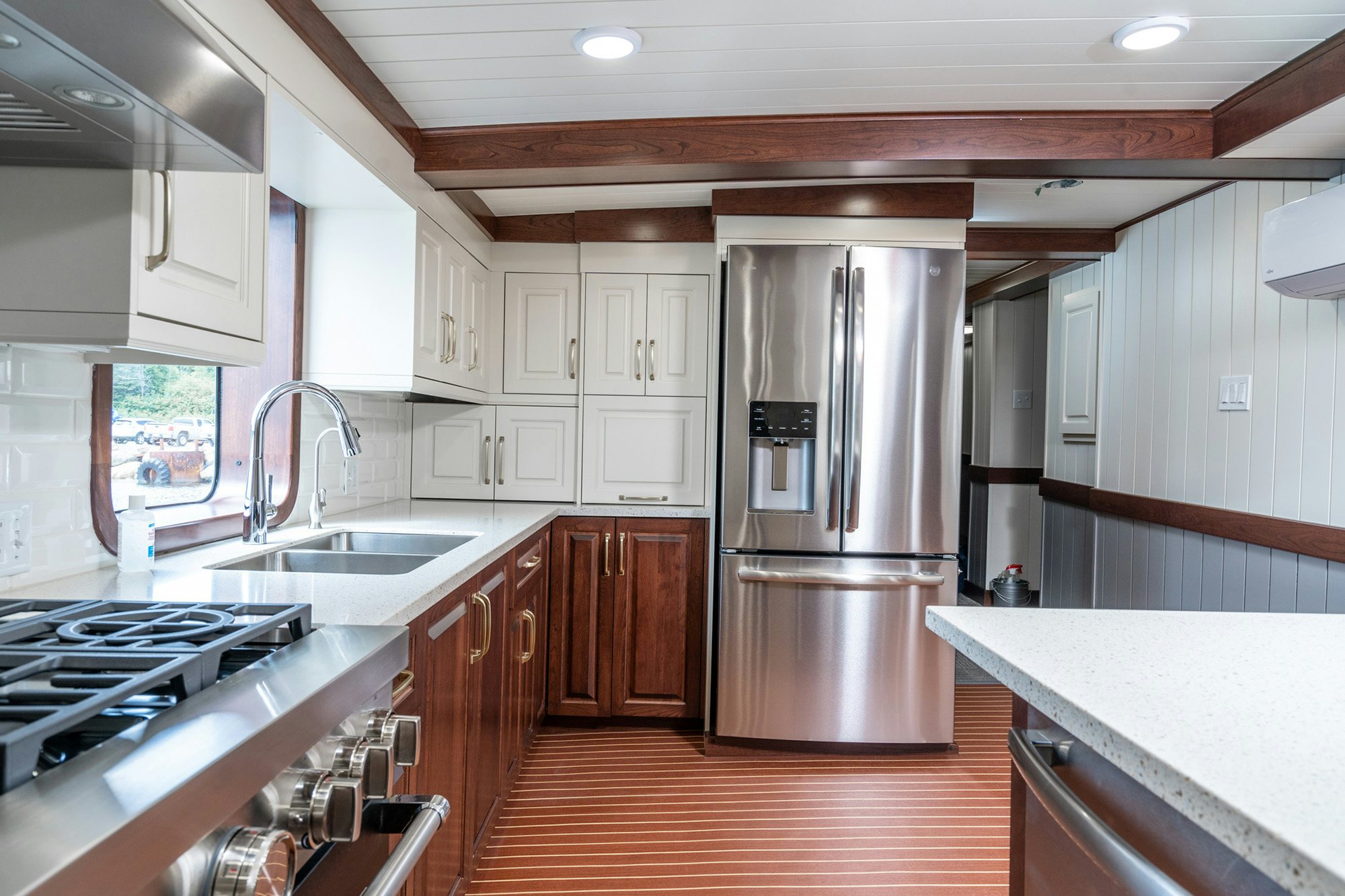 a kitchen with a stainless steel refrigerator aboard ANNE S PIERCE Yacht for Sale