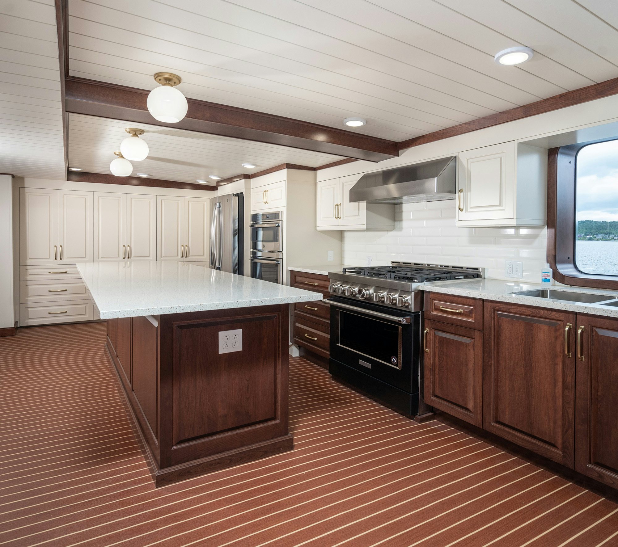 a large kitchen with wooden cabinets aboard ANNE S PIERCE Yacht for Sale