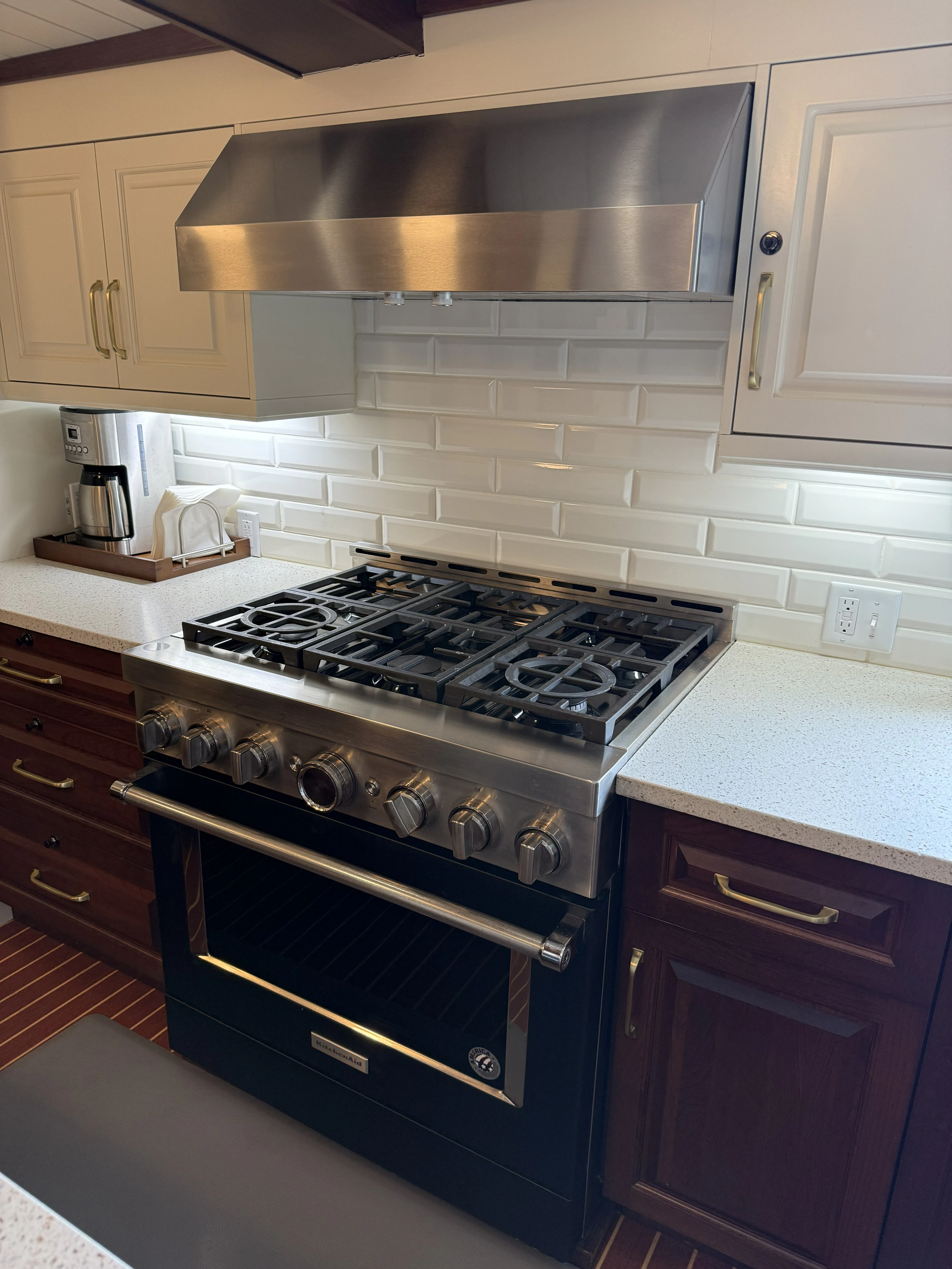 a kitchen with a stove and a chimney aboard ANNE S PIERCE Yacht for Sale