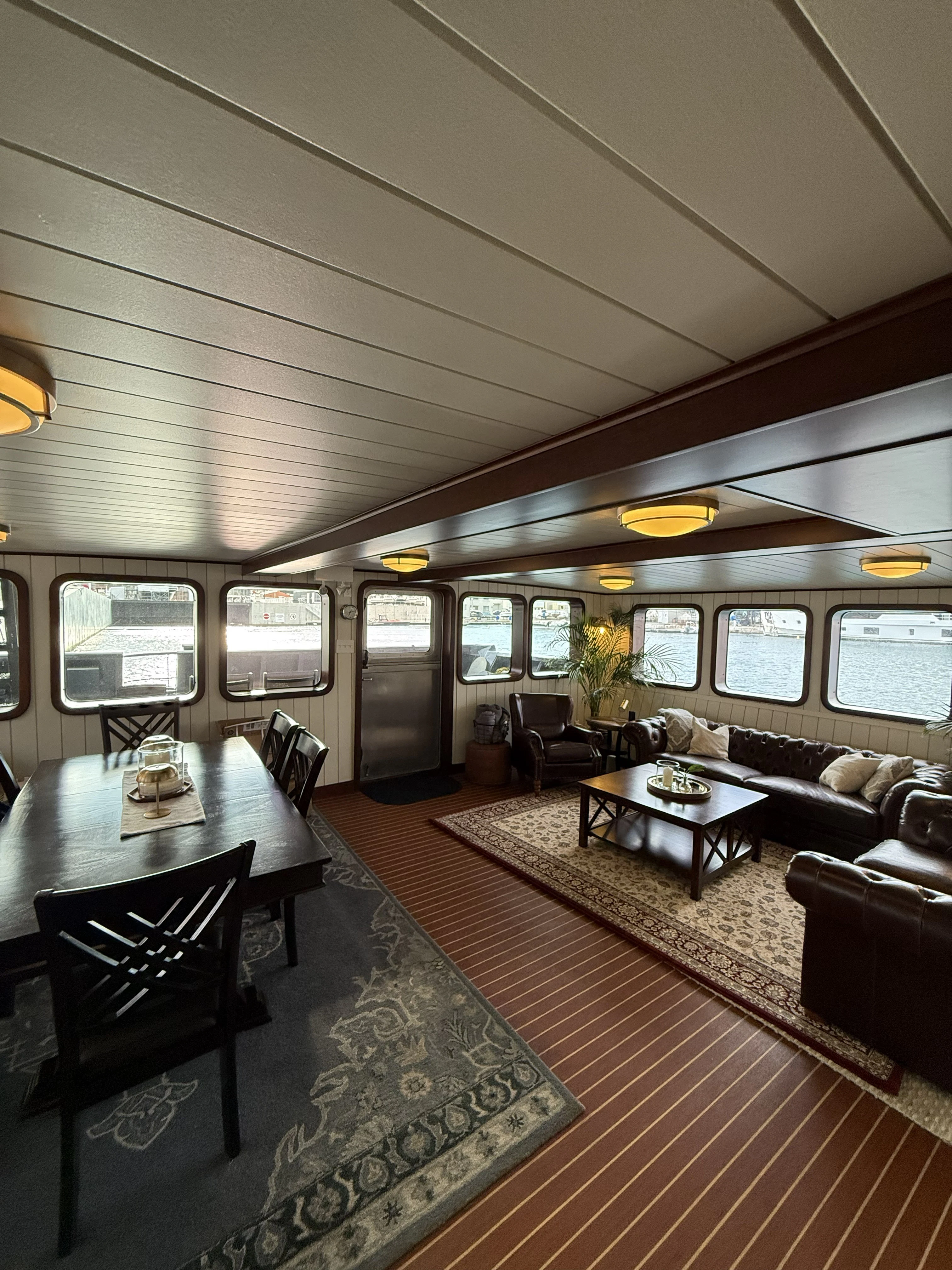 a room with a table and chairs aboard ANNE S PIERCE Yacht for Sale