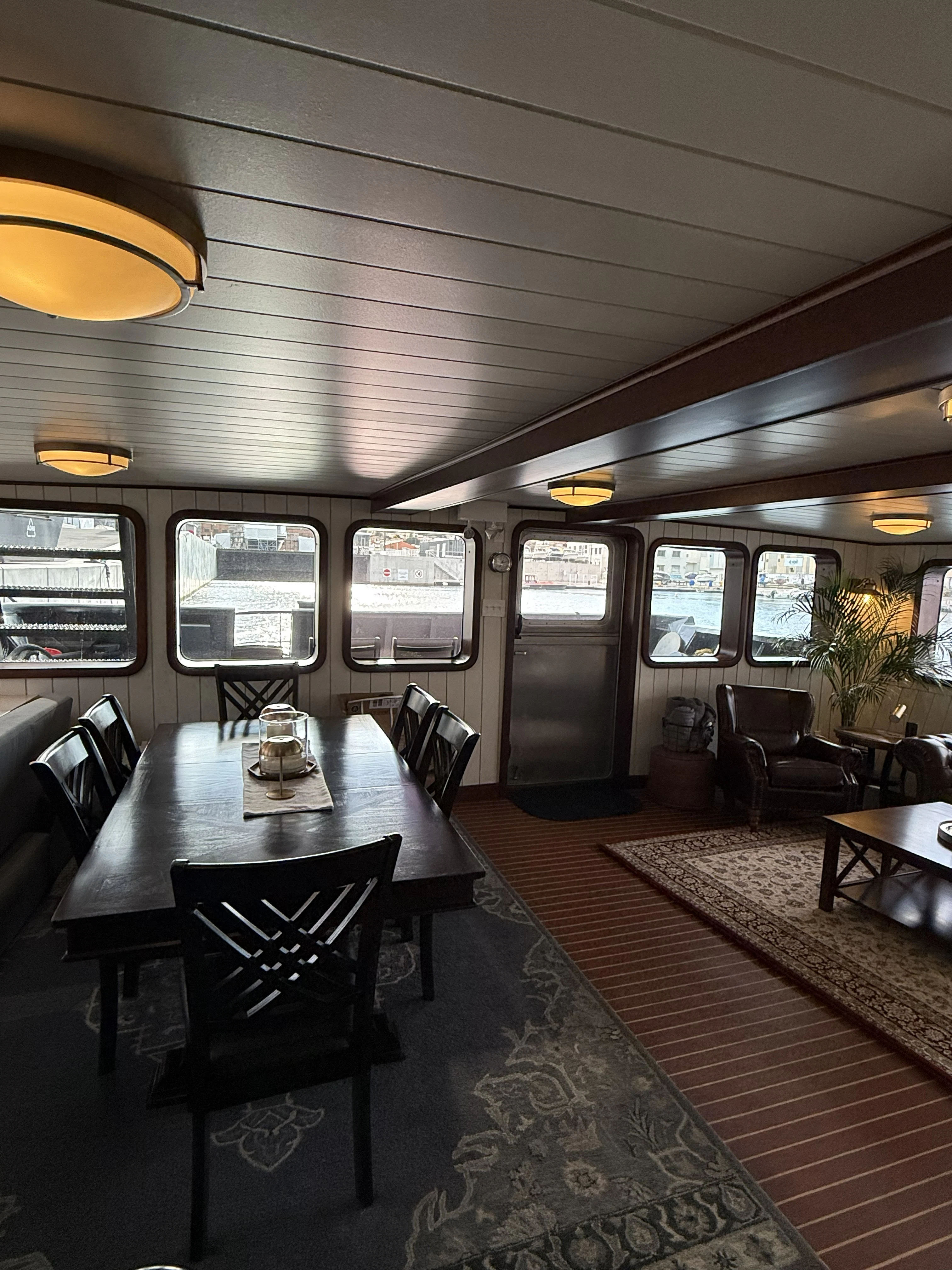 a room with a table and chairs aboard ANNE S PIERCE Yacht for Sale