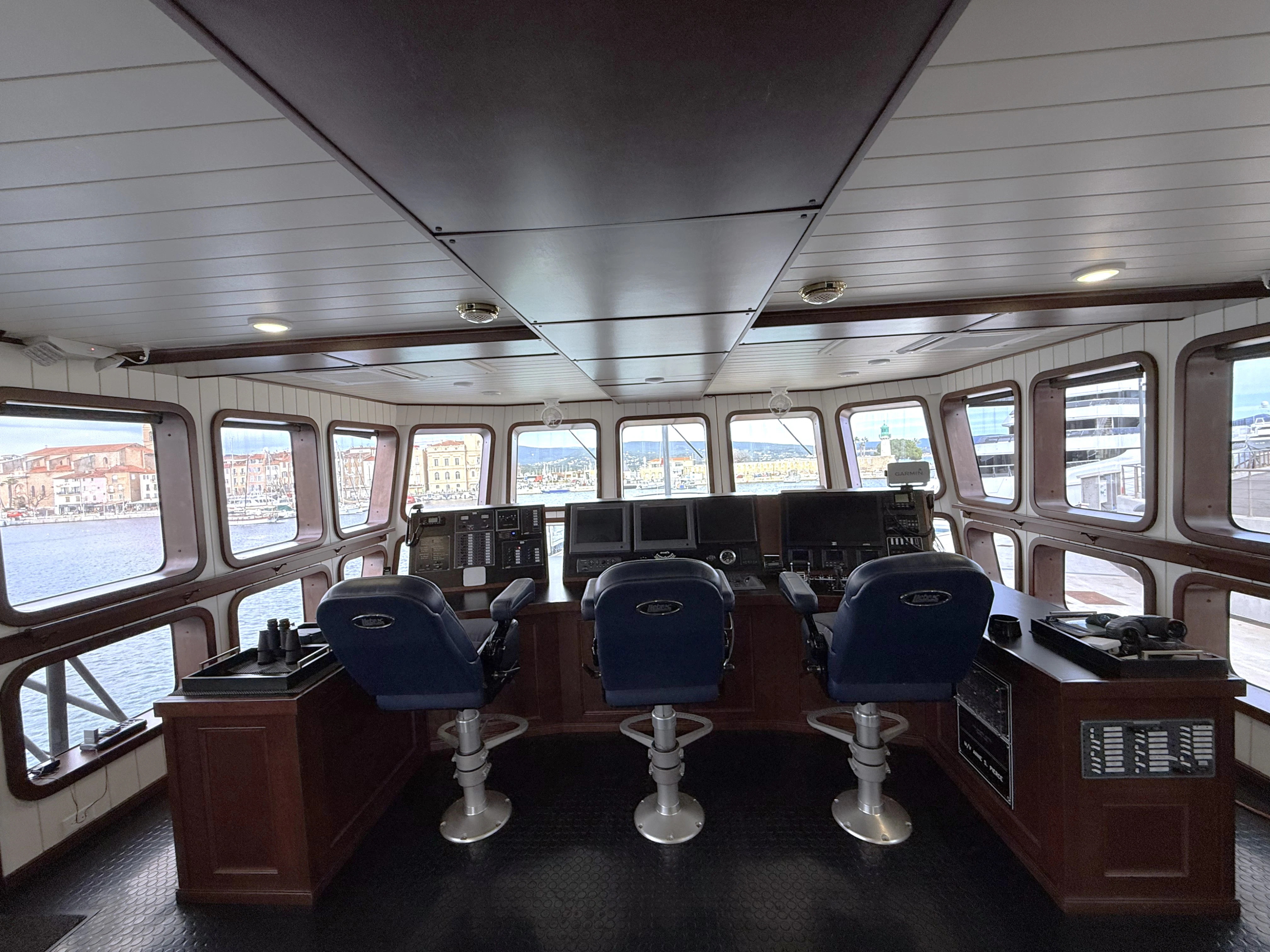 a room with chairs and a table aboard ANNE S PIERCE Yacht for Sale