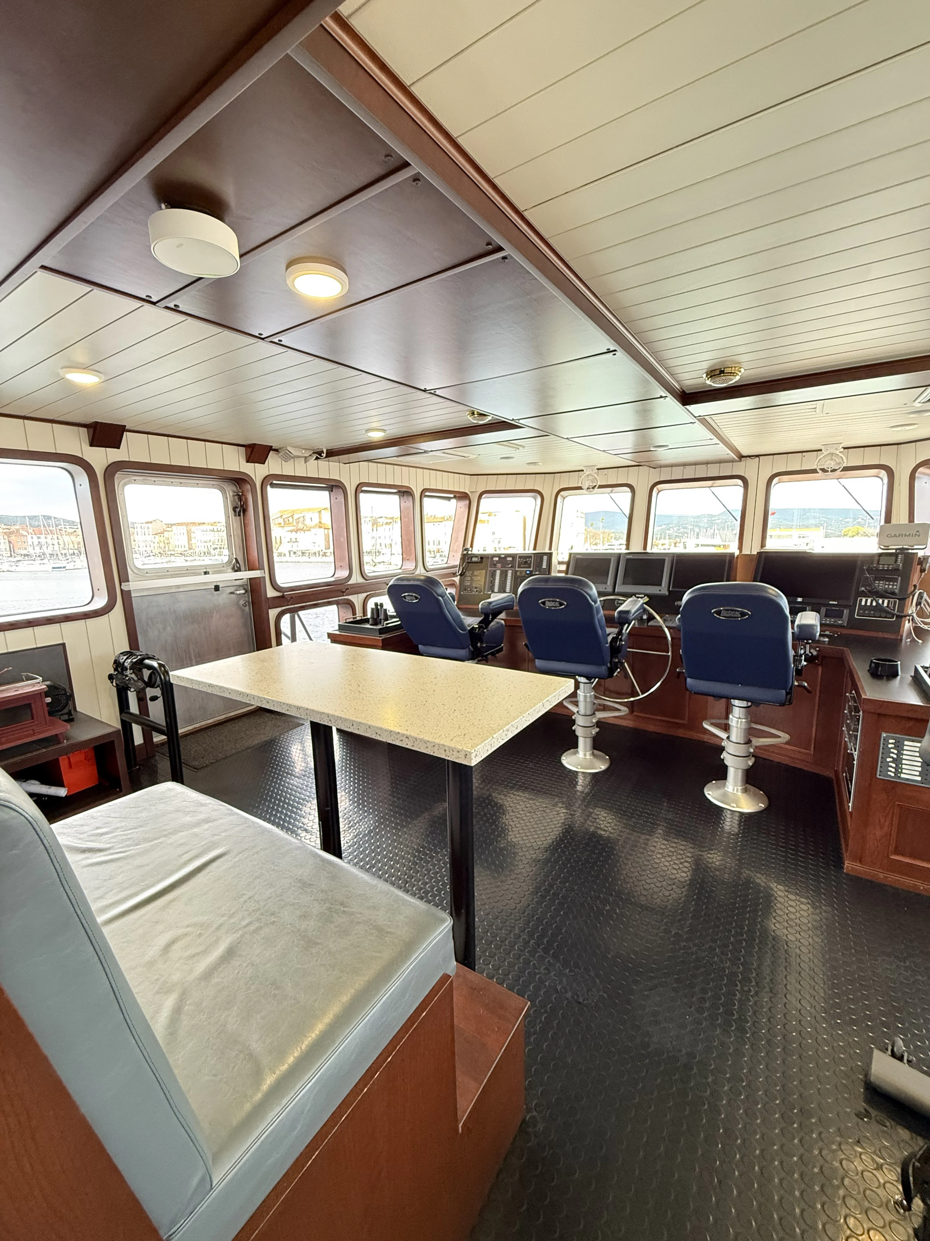 a room with a table and chairs aboard ANNE S PIERCE Yacht for Sale