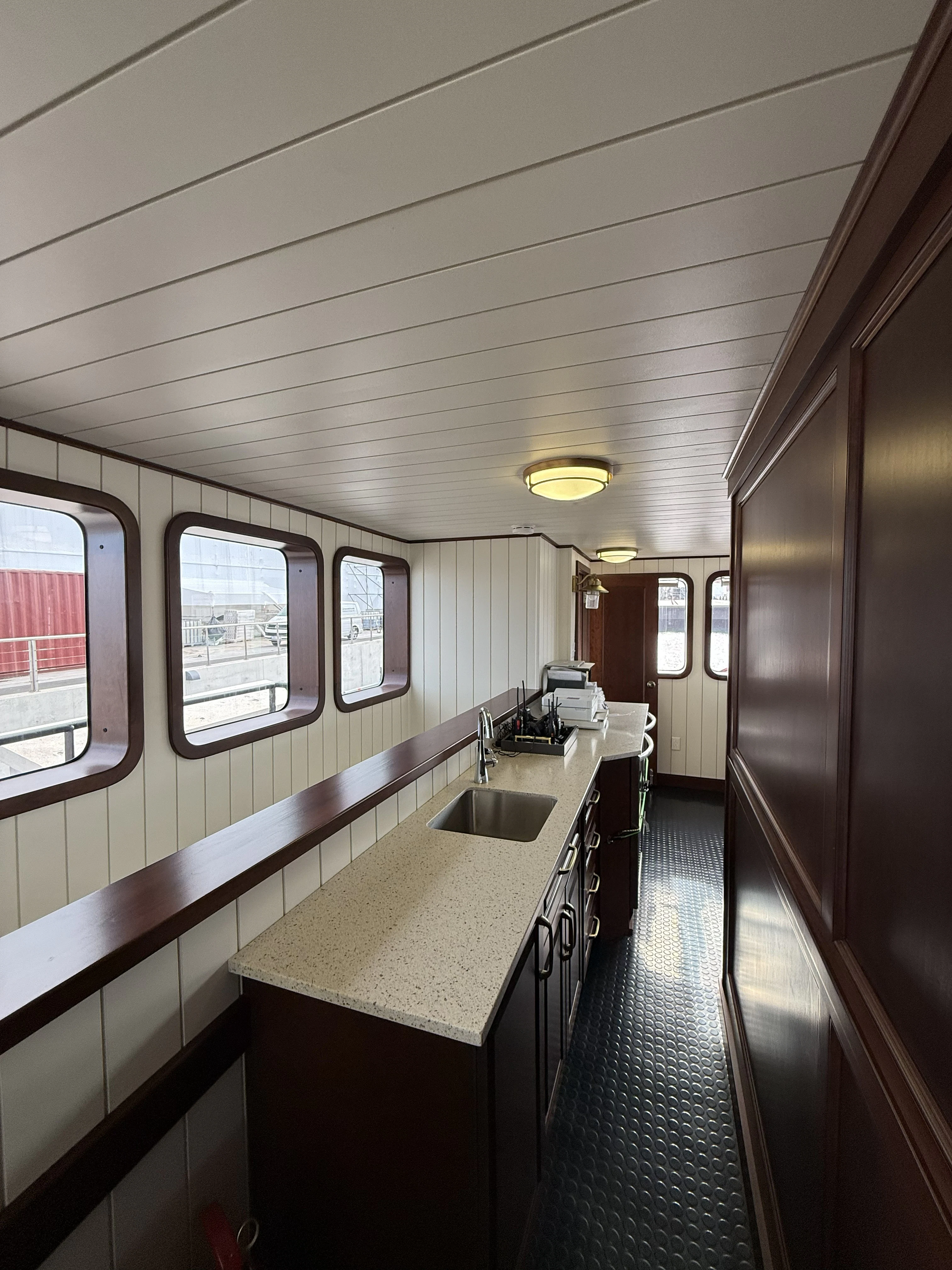 a long narrow bathroom with a long countertop aboard ANNE S PIERCE Yacht for Sale