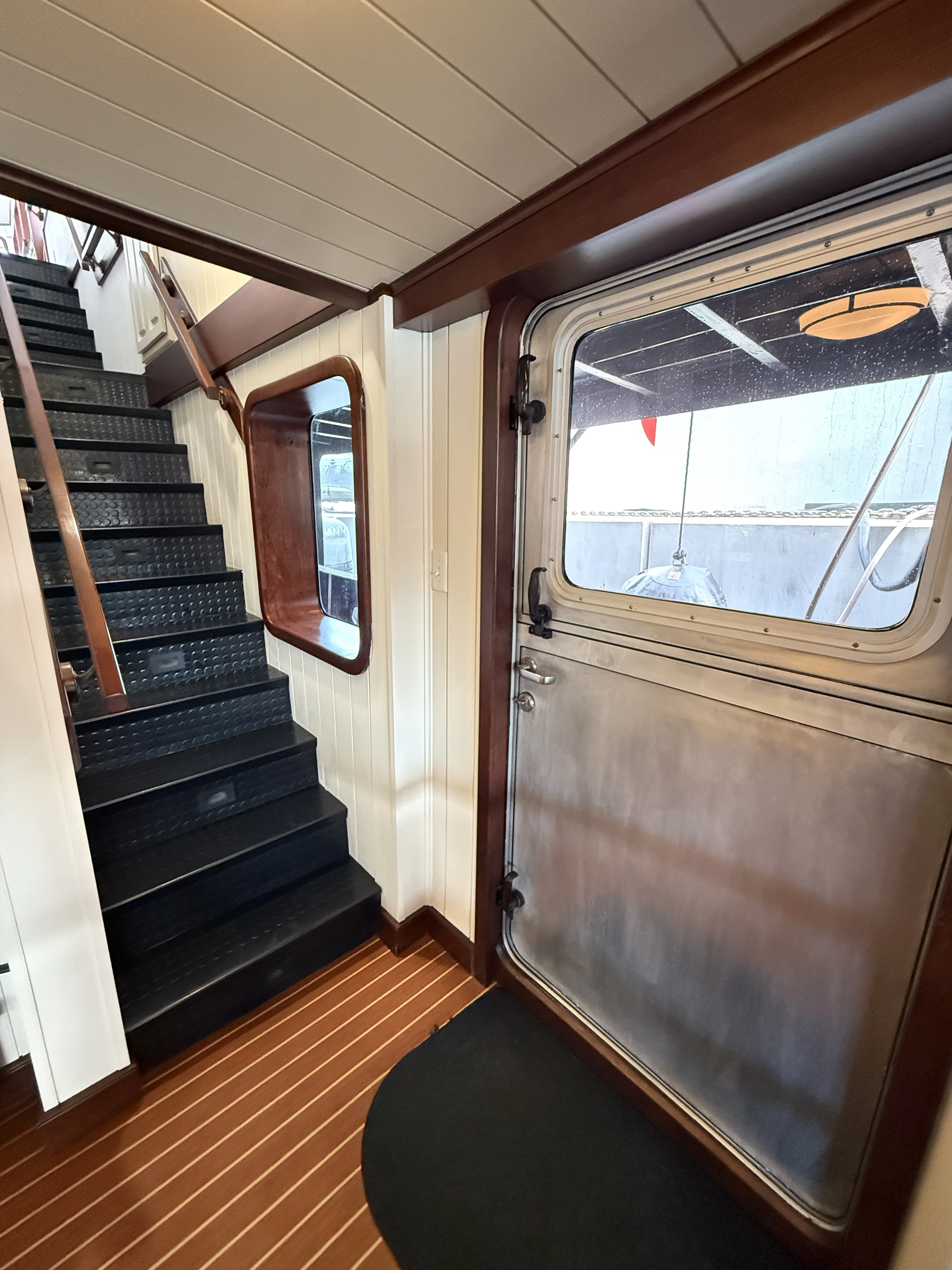 a wooden cabin with a large window aboard ANNE S PIERCE Yacht for Sale