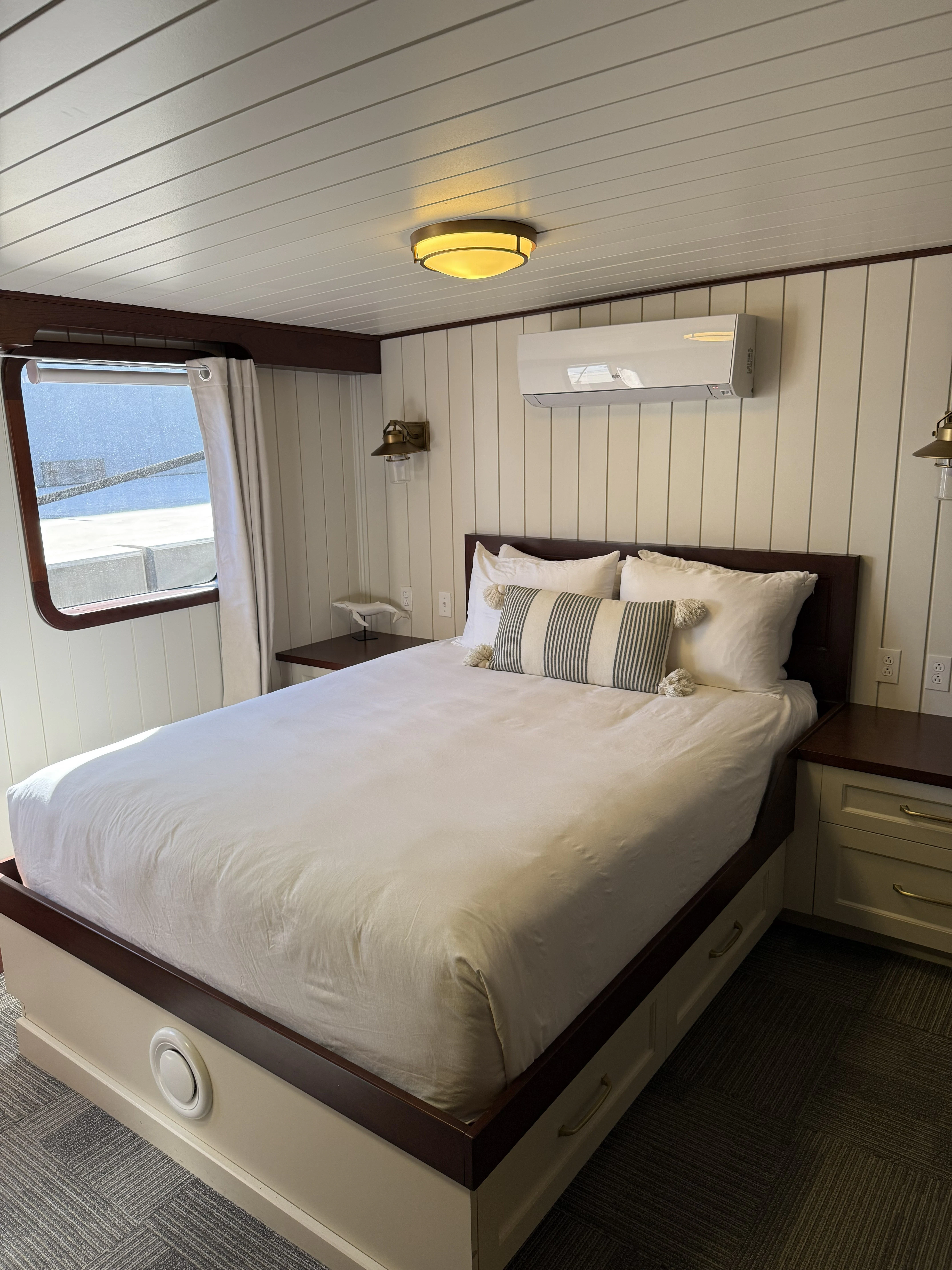 a bed with a white comforter aboard ANNE S PIERCE Yacht for Sale