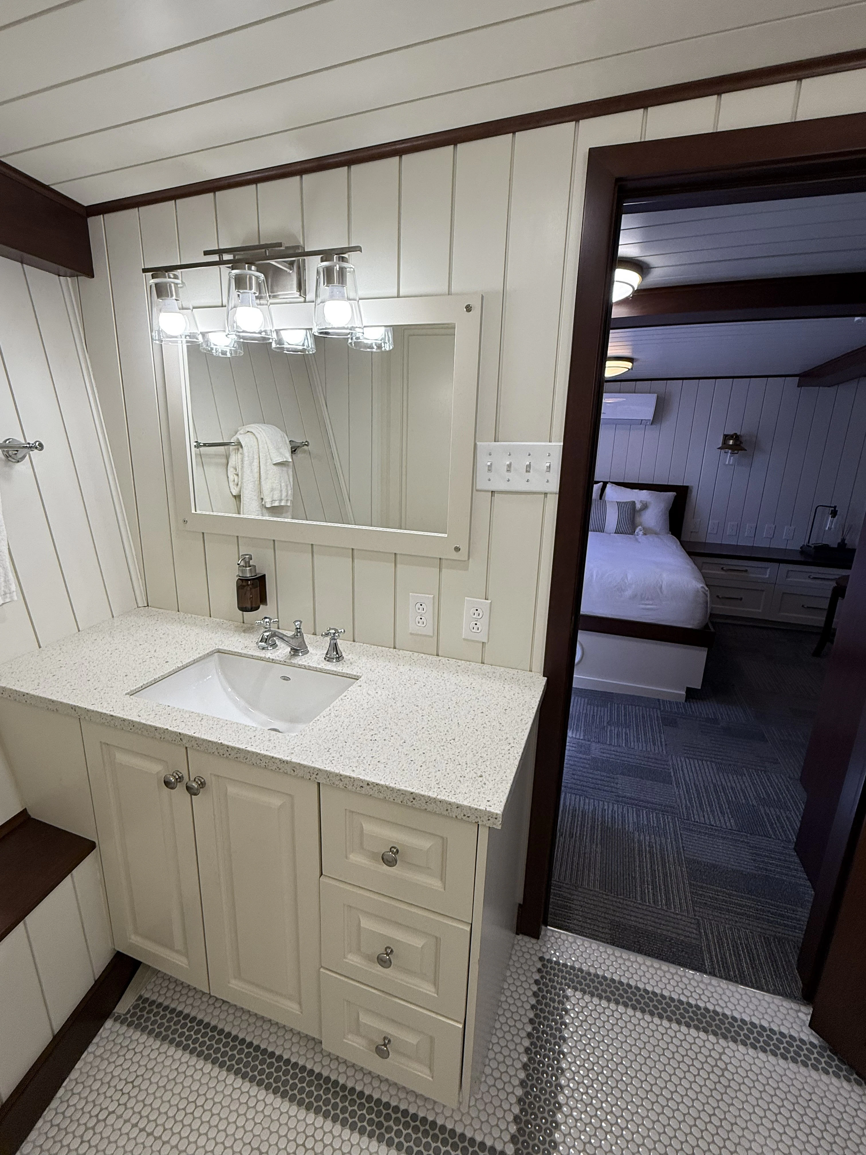 a bathroom with a sink and a mirror aboard ANNE S PIERCE Yacht for Sale