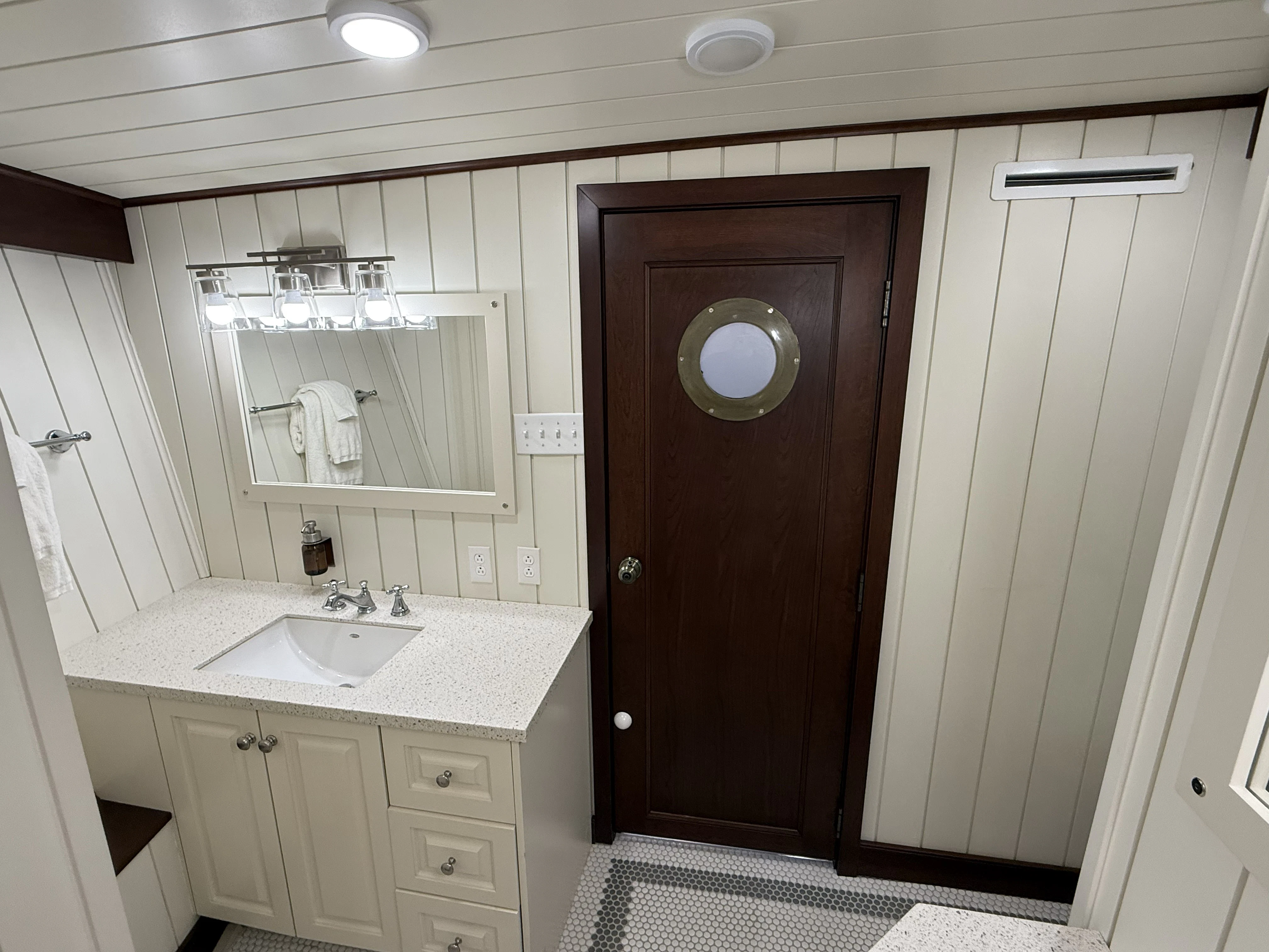 a bathroom with a sink and a mirror aboard ANNE S PIERCE Yacht for Sale