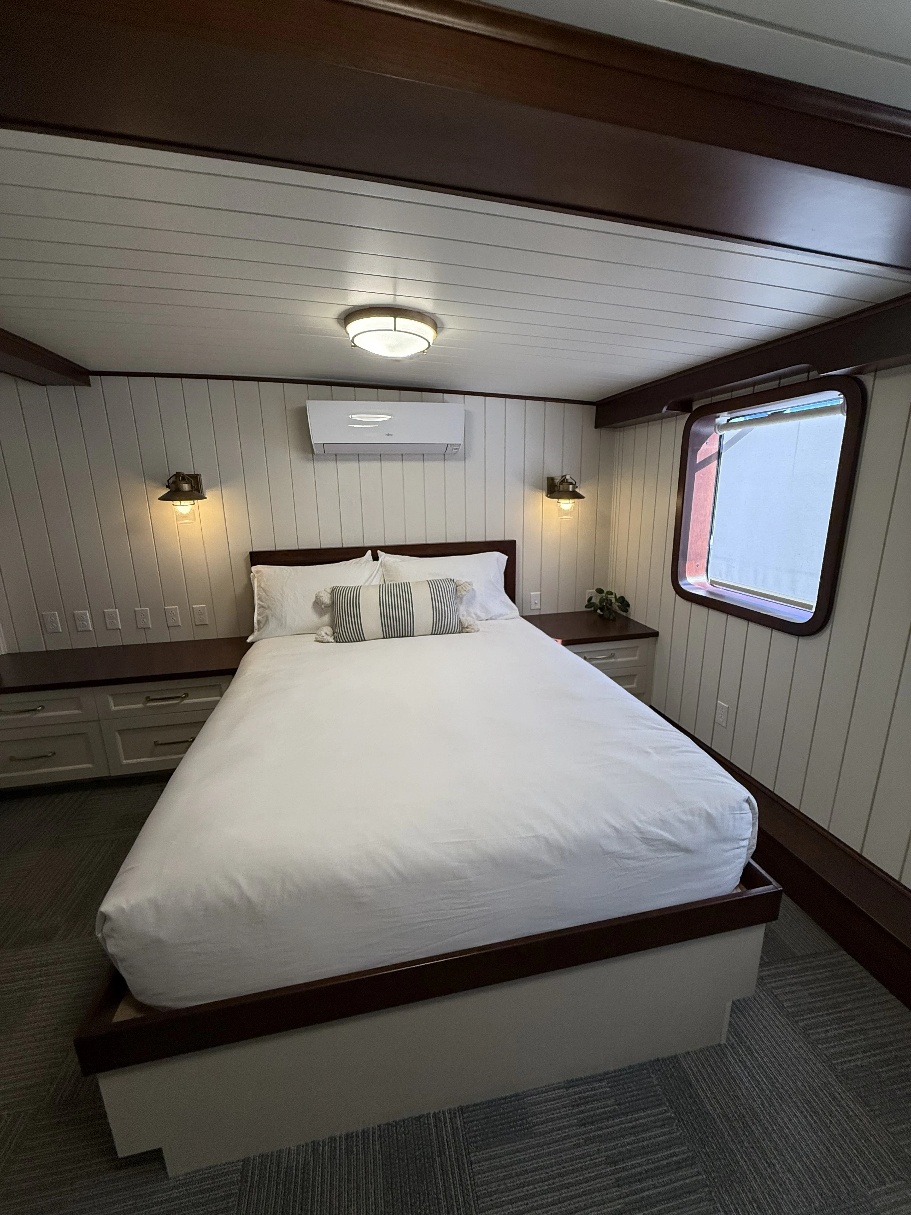 a bed with a white bed spread aboard ANNE S PIERCE Yacht for Sale