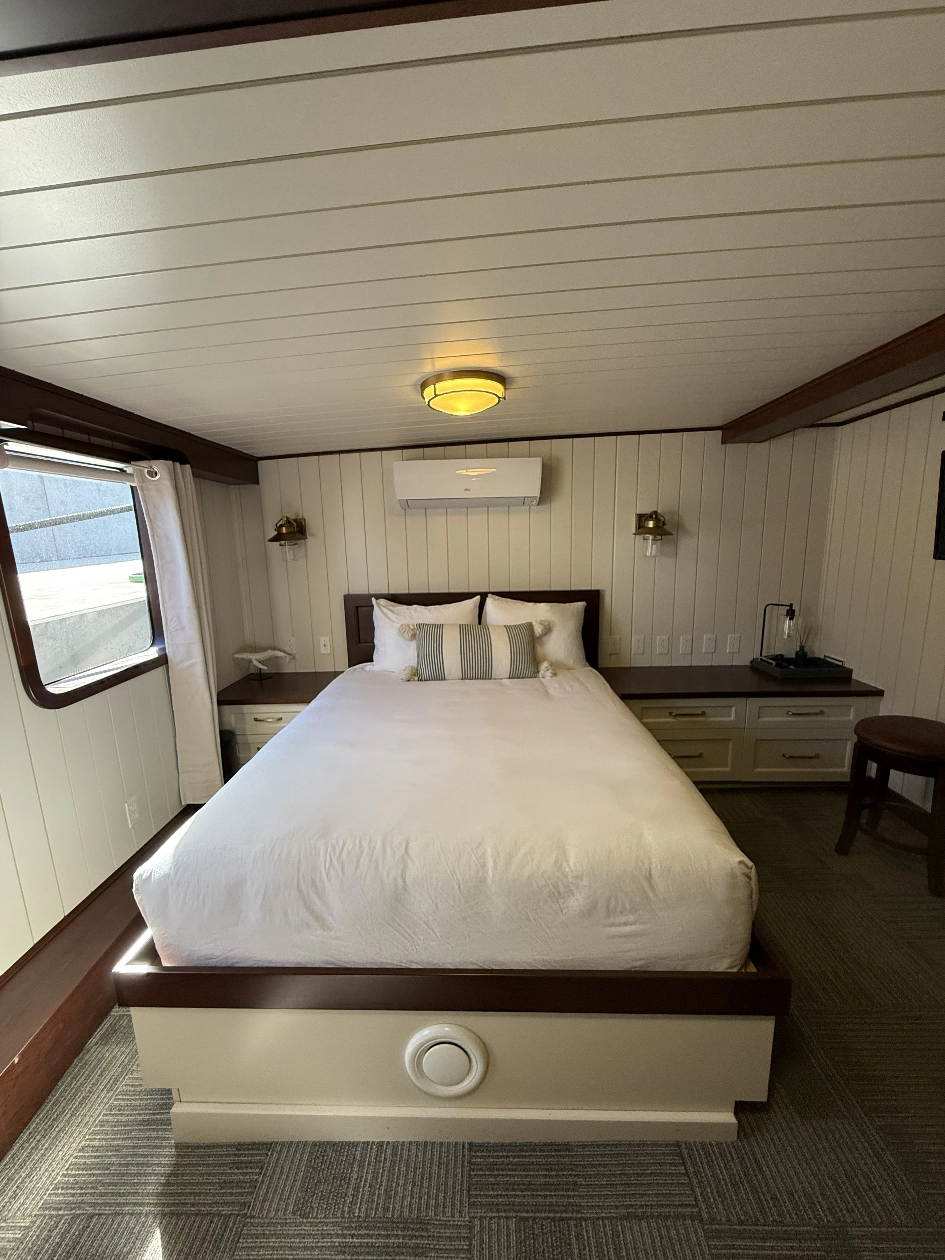 a bed with a white comforter aboard ANNE S PIERCE Yacht for Sale