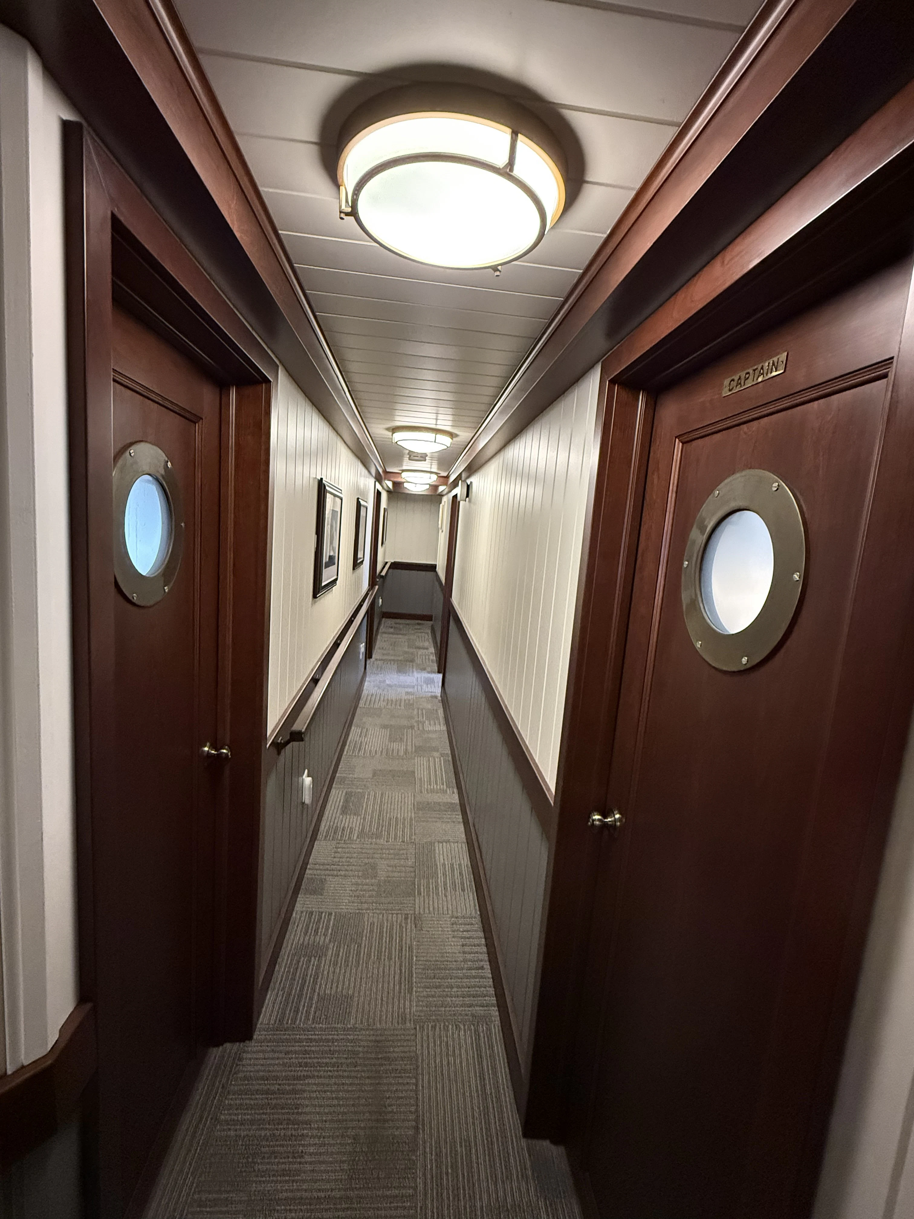 a hallway with a row of doors aboard ANNE S PIERCE Yacht for Sale