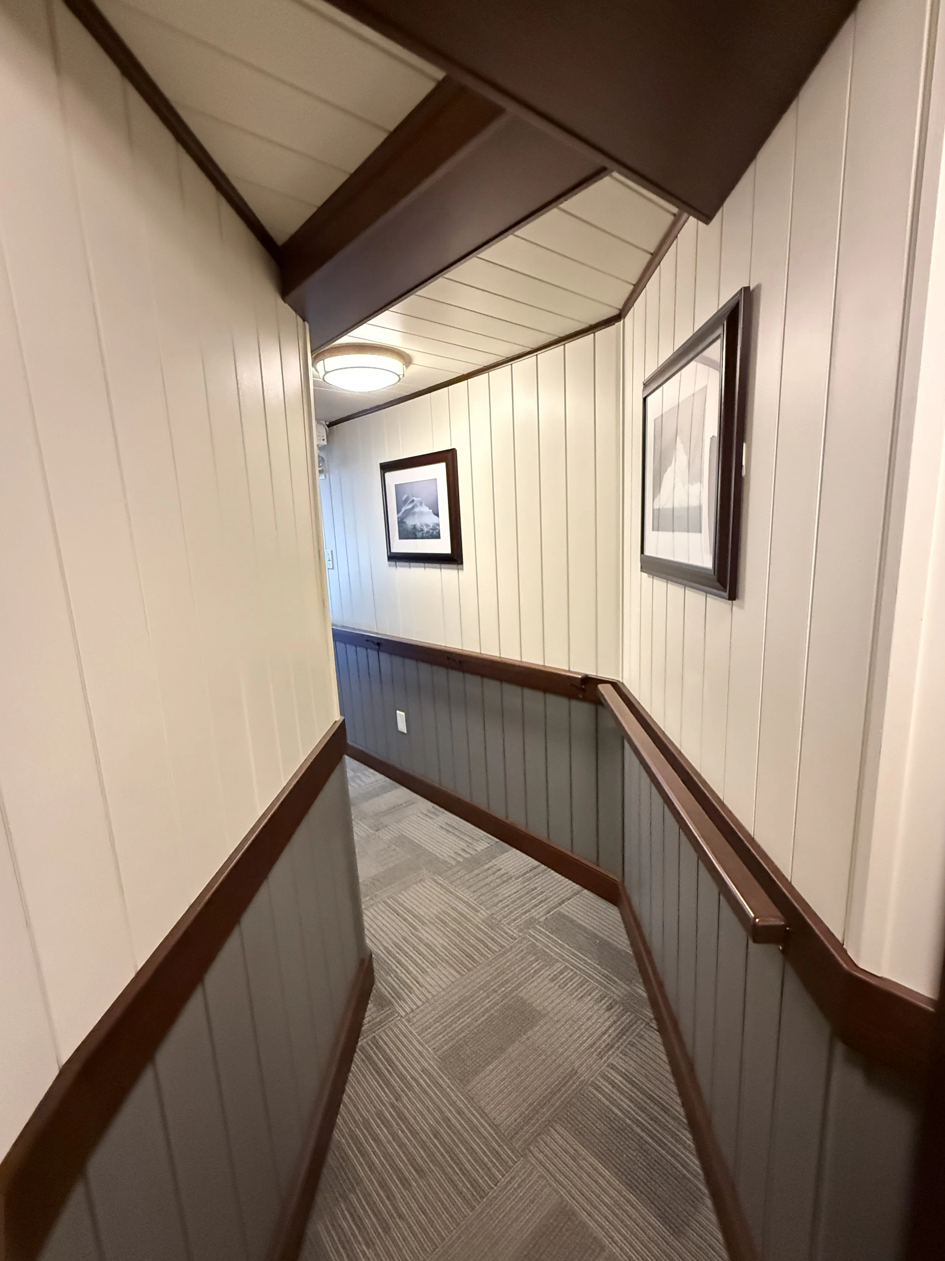 a wooden walkway with a wood railing aboard ANNE S PIERCE Yacht for Sale