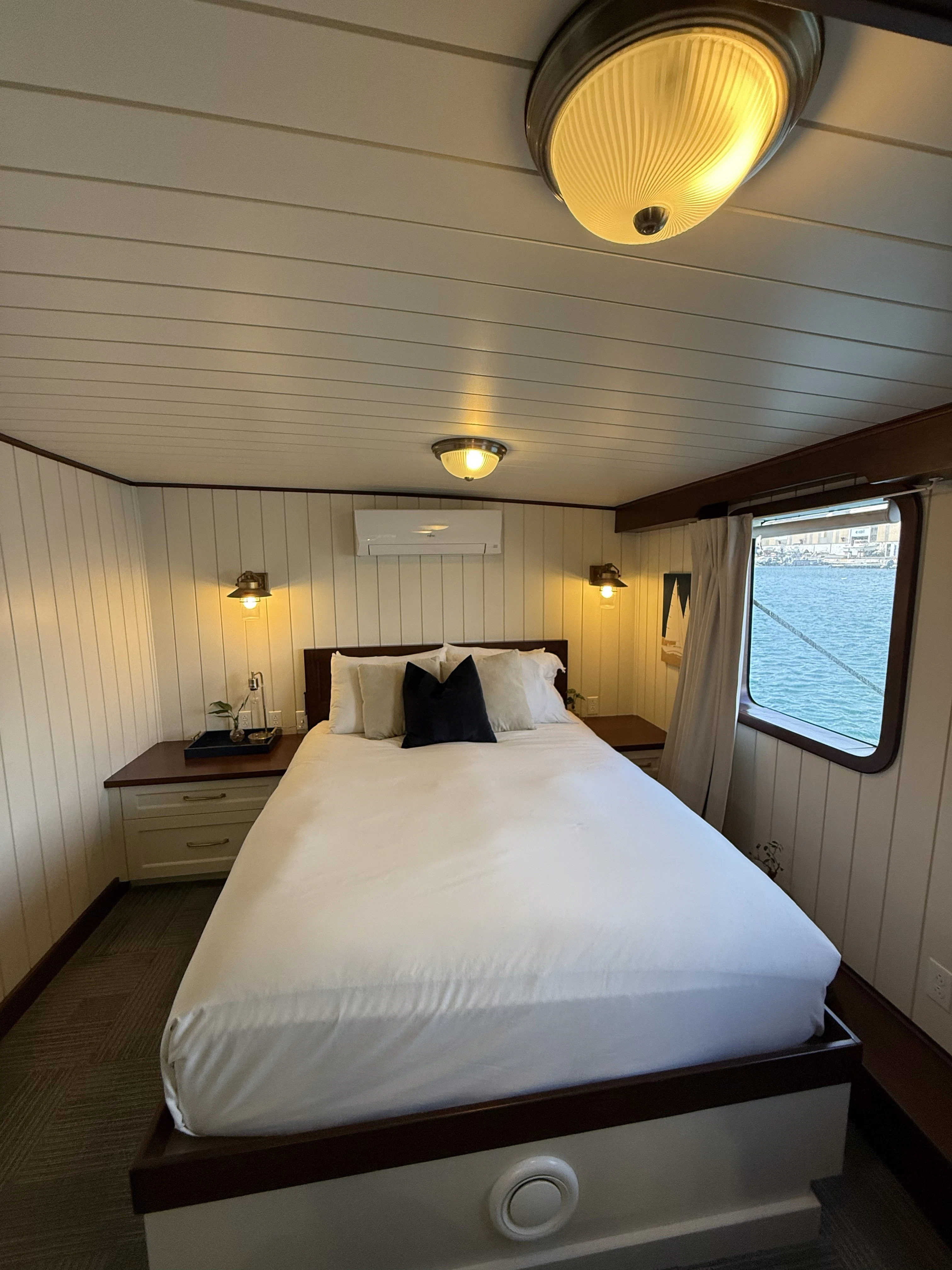 a bed with a white sheet aboard ANNE S PIERCE Yacht for Sale
