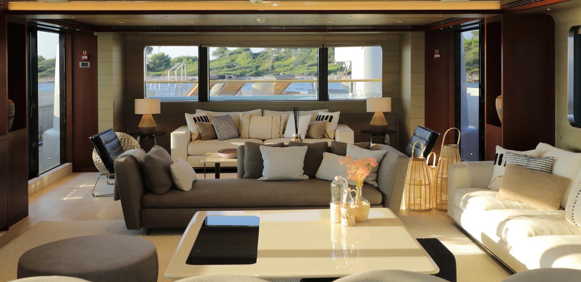 a living room with a large window aboard X Yacht for Sale