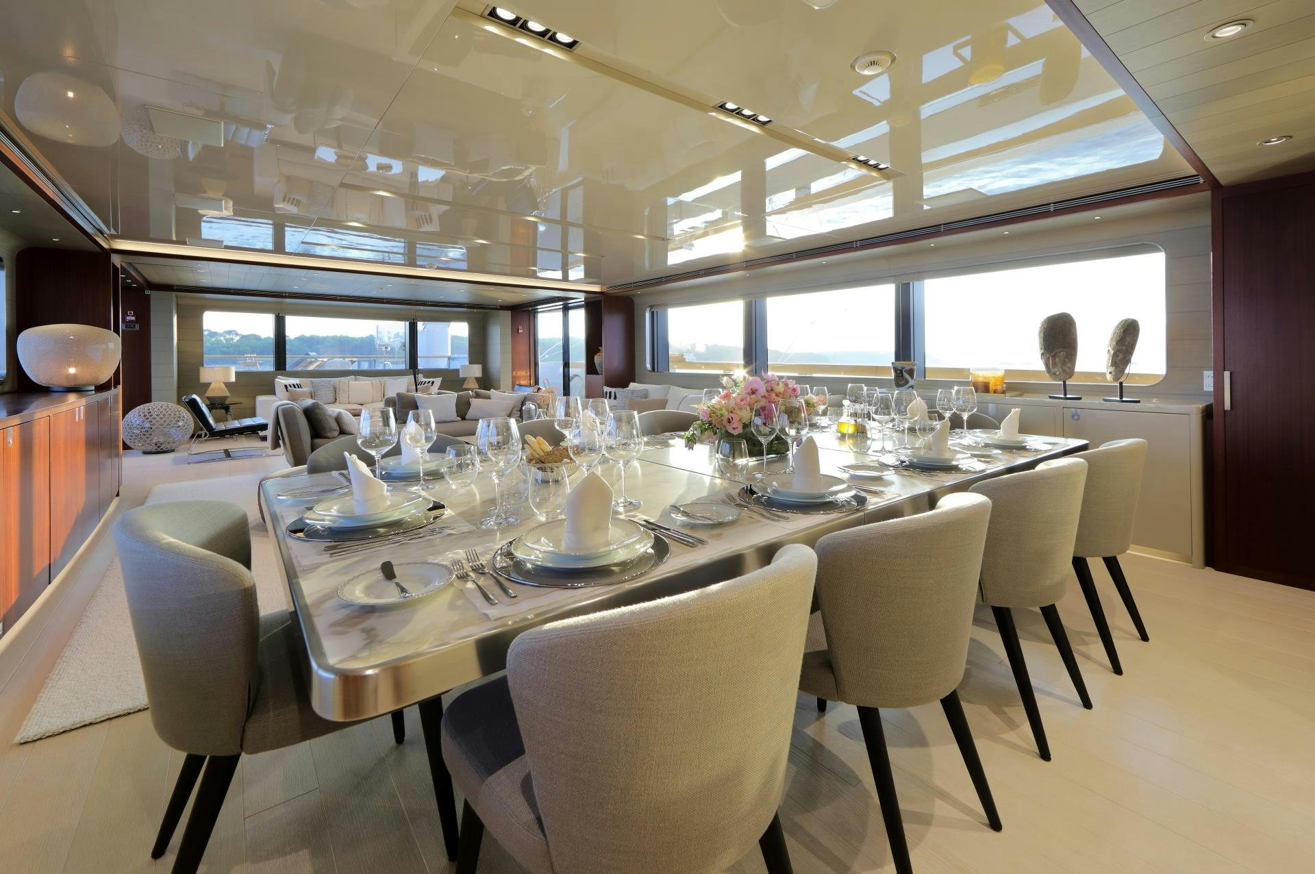 a large dining room table aboard X Yacht for Sale
