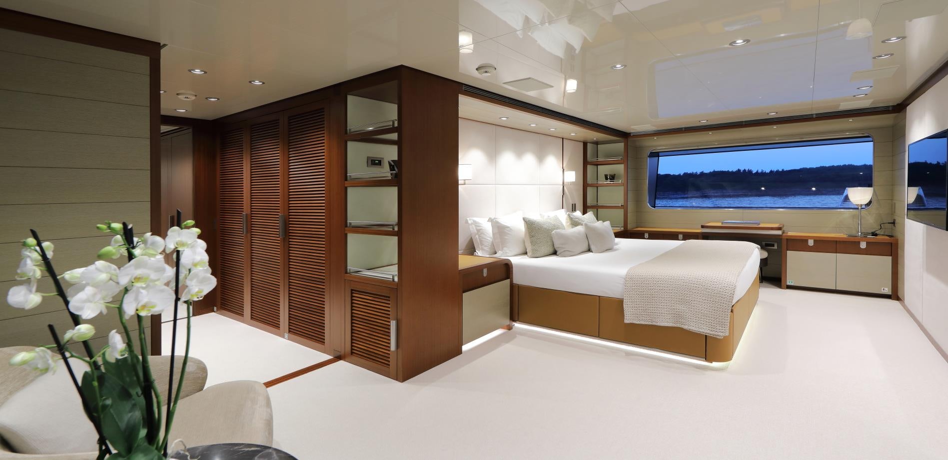 a room with a bed and a tv aboard X Yacht for Sale