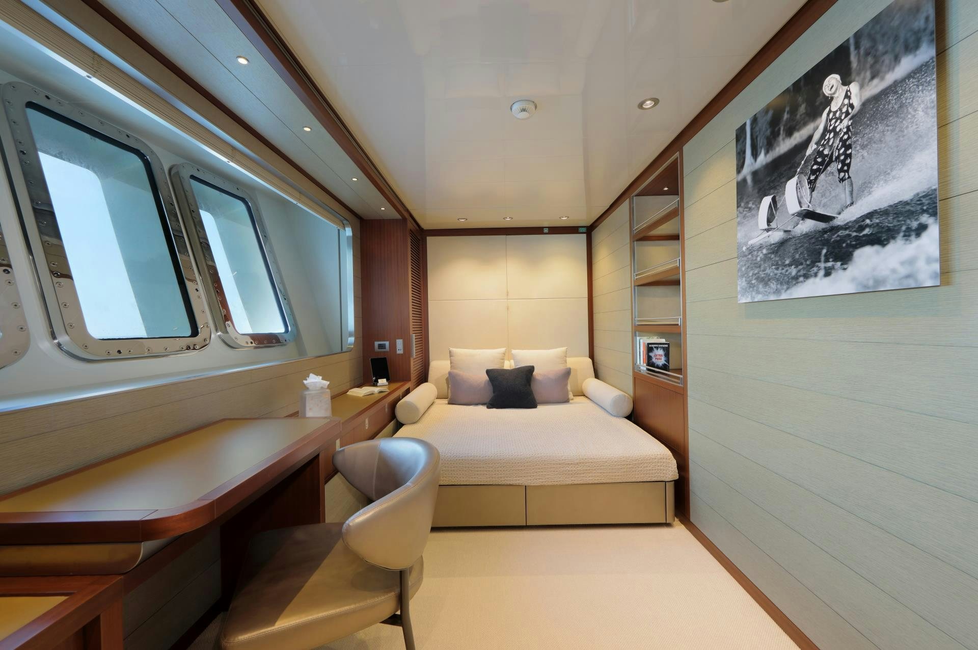 a room with a bed and a desk aboard X Yacht for Sale