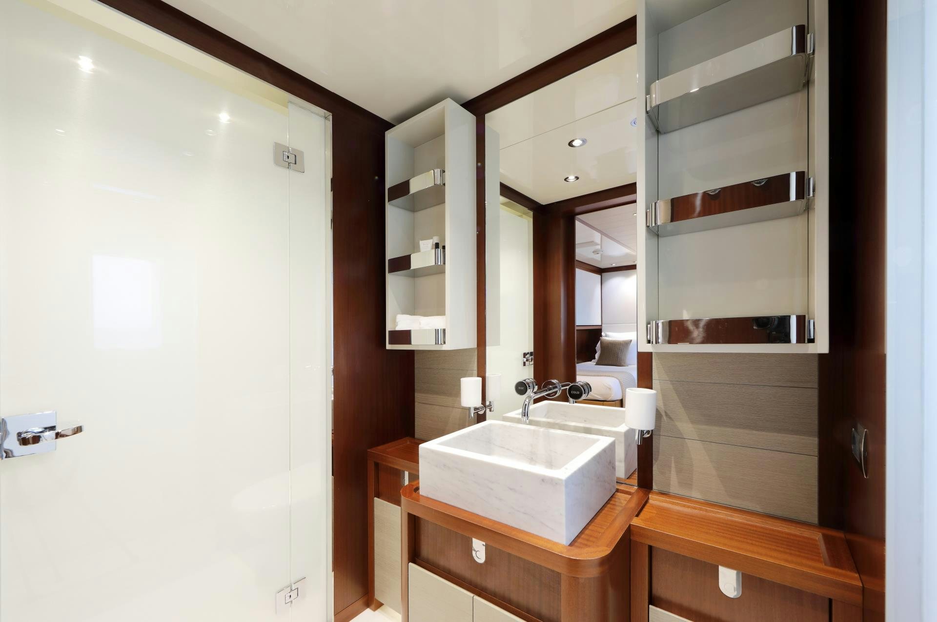 a bathroom with a sink and a mirror aboard X Yacht for Sale