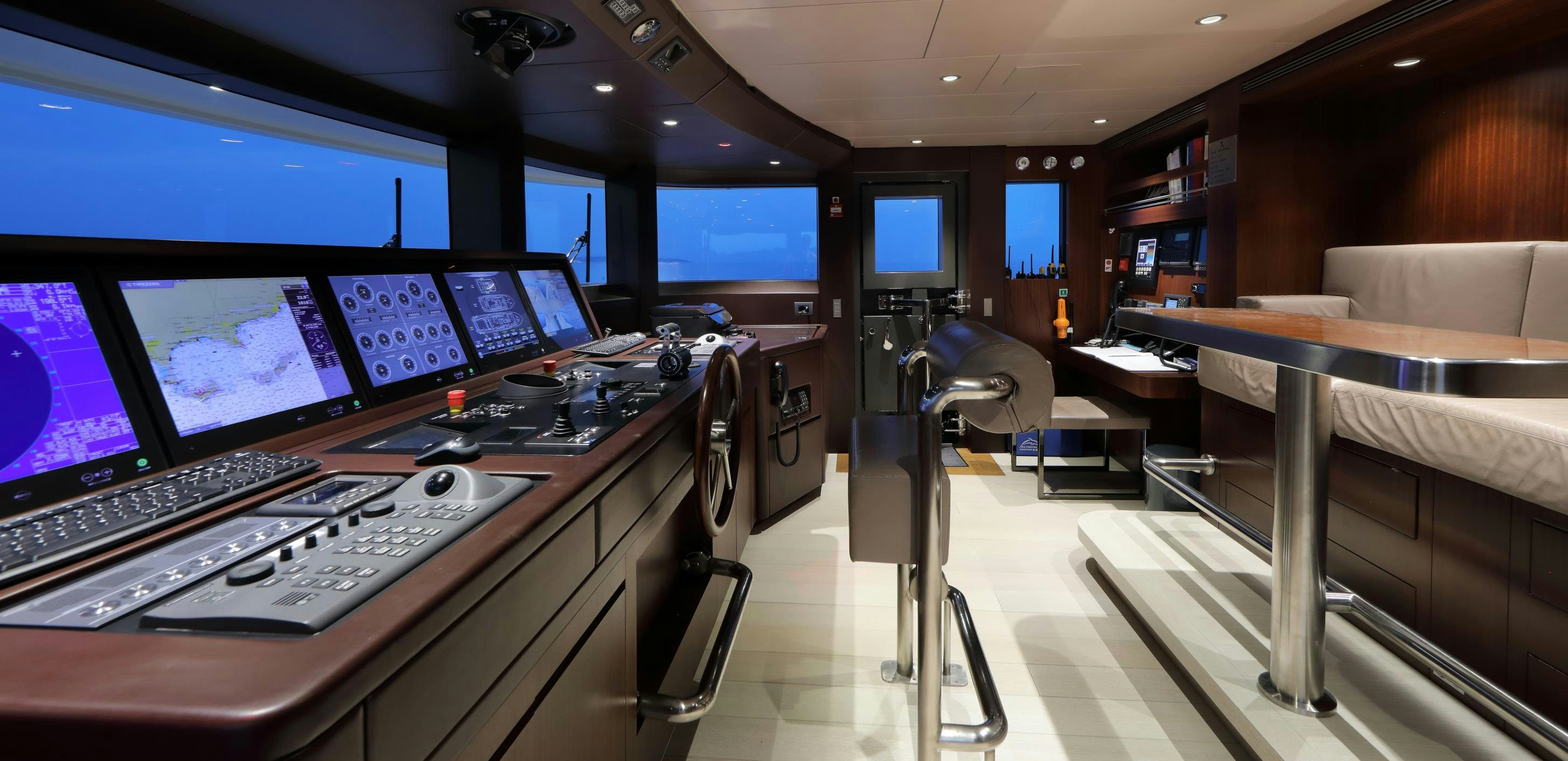 a room with a row of computers aboard X Yacht for Sale