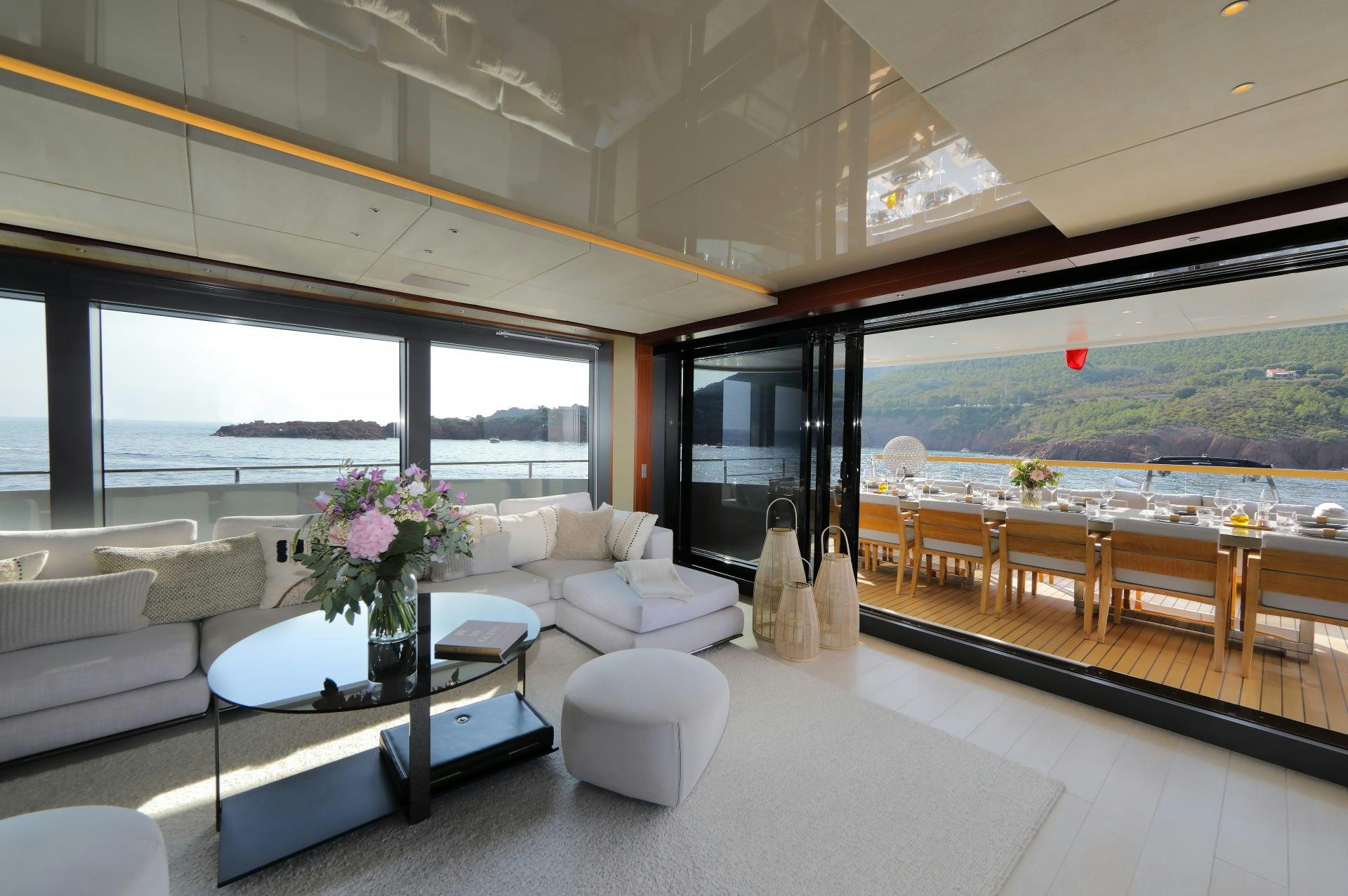 a room with a table and chairs aboard X Yacht for Sale