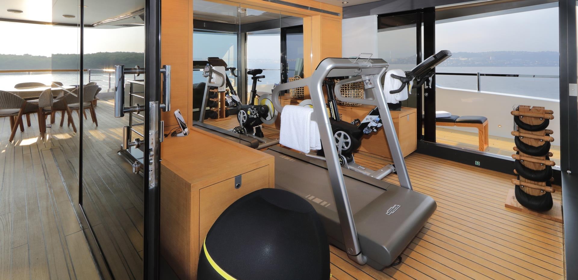 a treadmill in a room aboard X Yacht for Sale