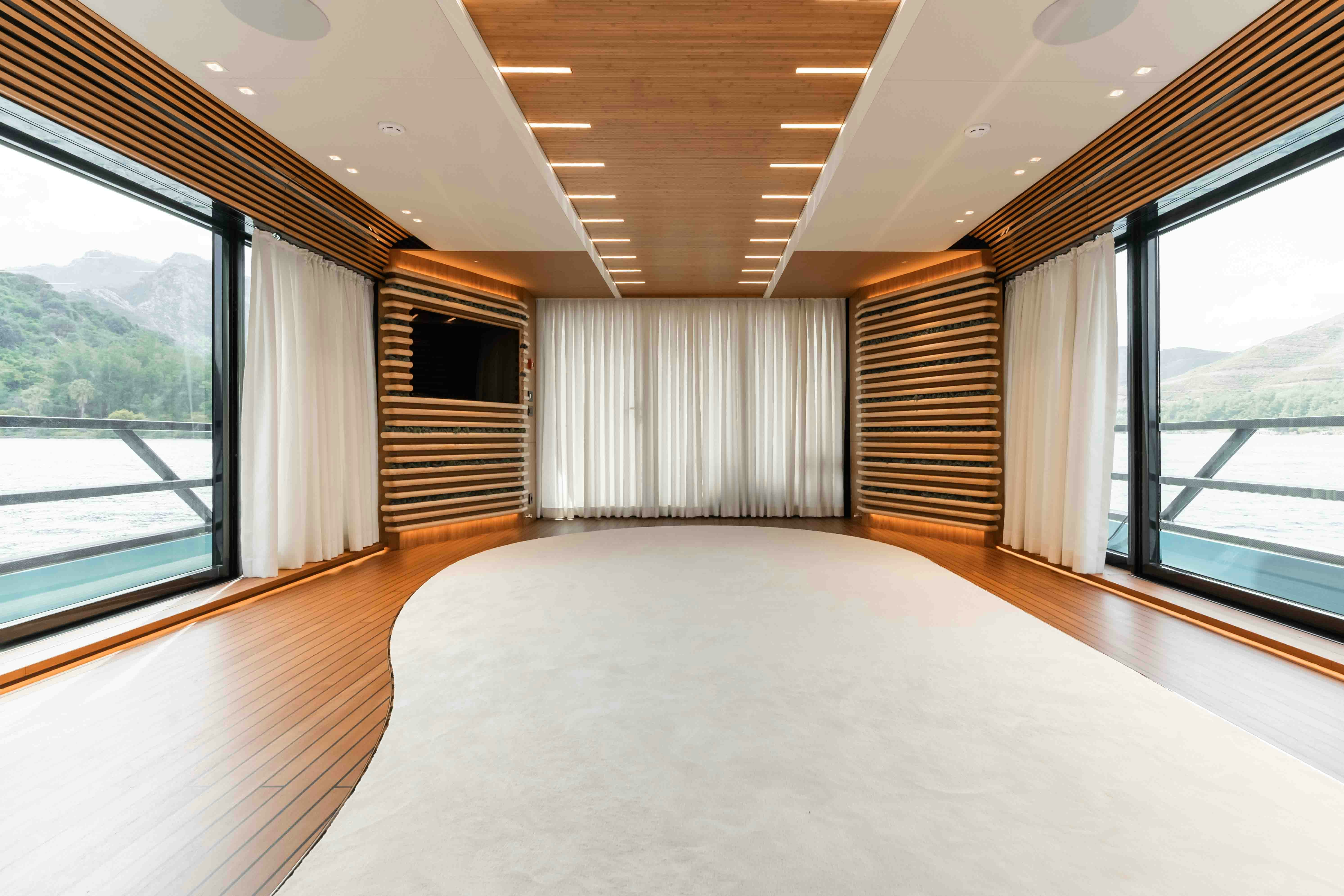 a large bedroom with a large window aboard NB 202 Yacht for Sale