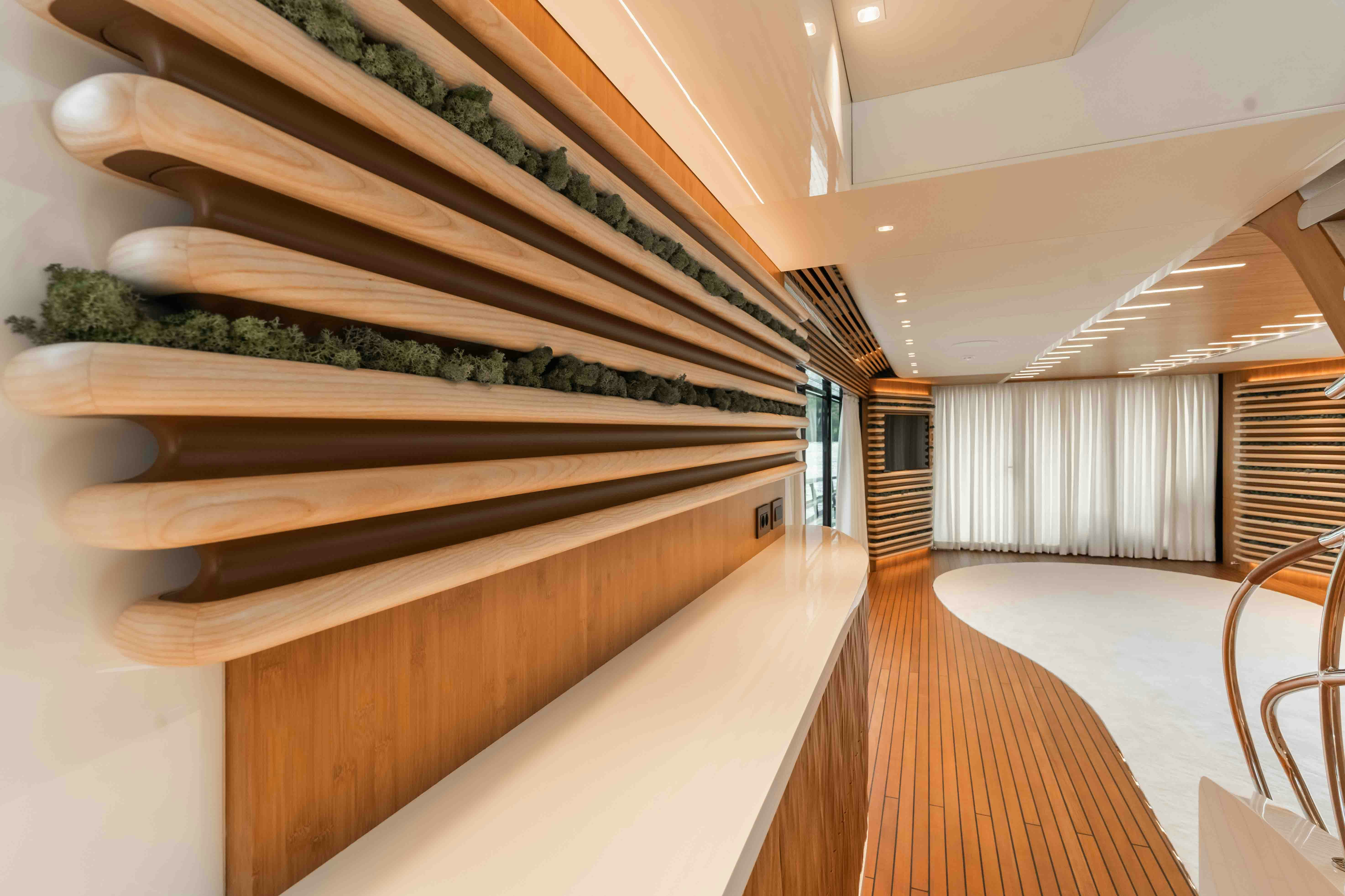 a large room with a staircase aboard NB 202 Yacht for Sale