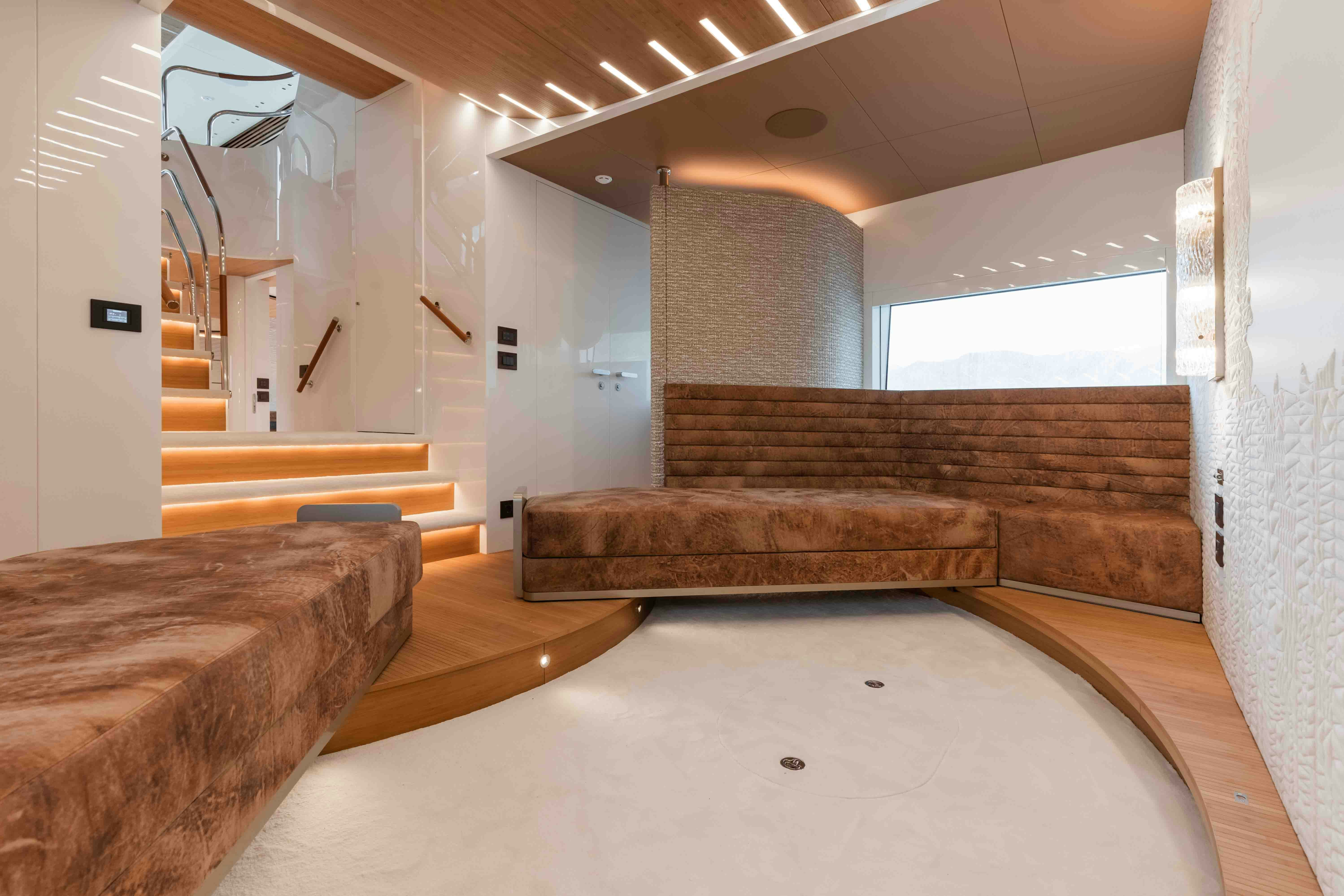 a room with a couch and a staircase aboard NB 202 Yacht for Sale