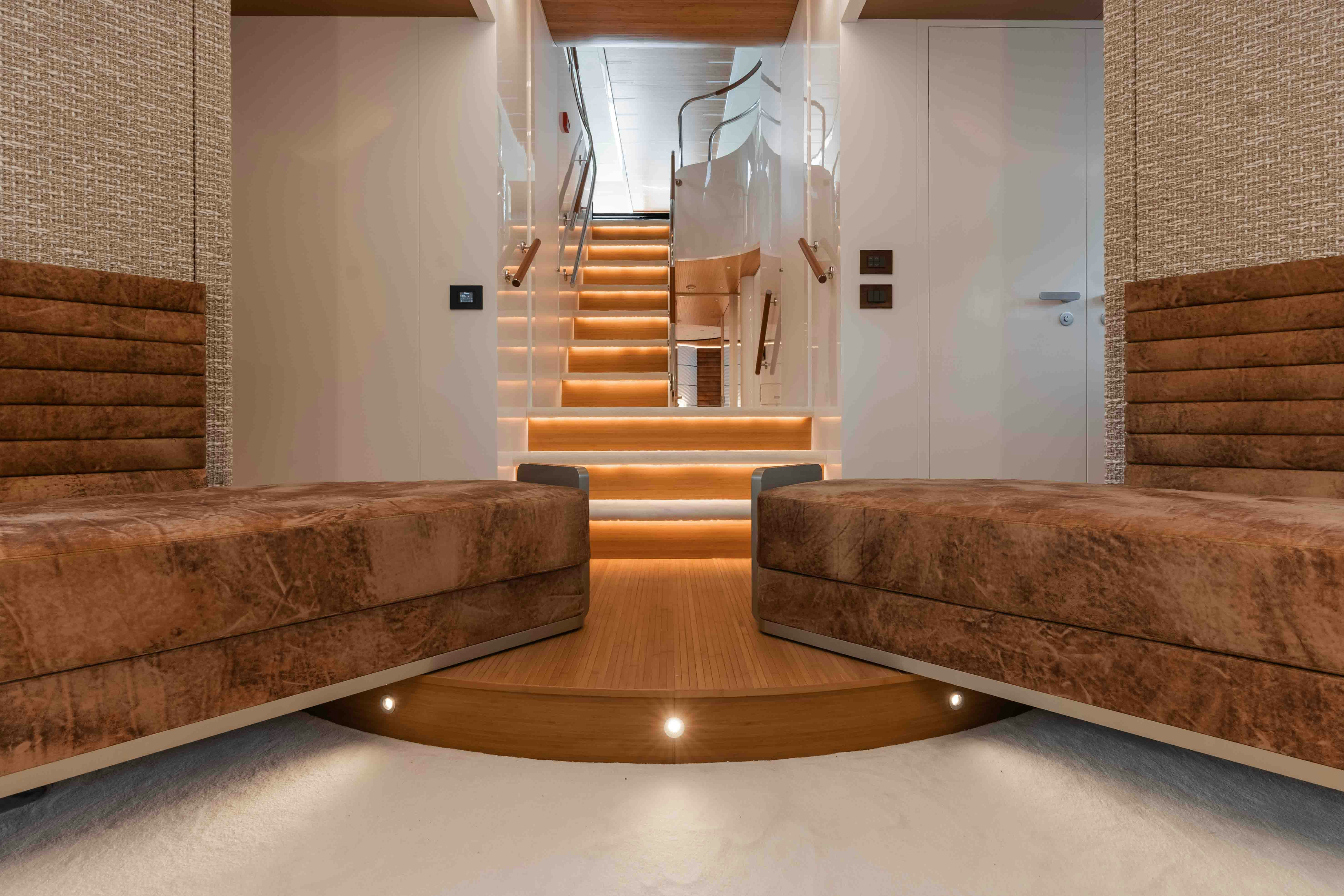 a living room with a staircase and a couch aboard NB 202 Yacht for Sale